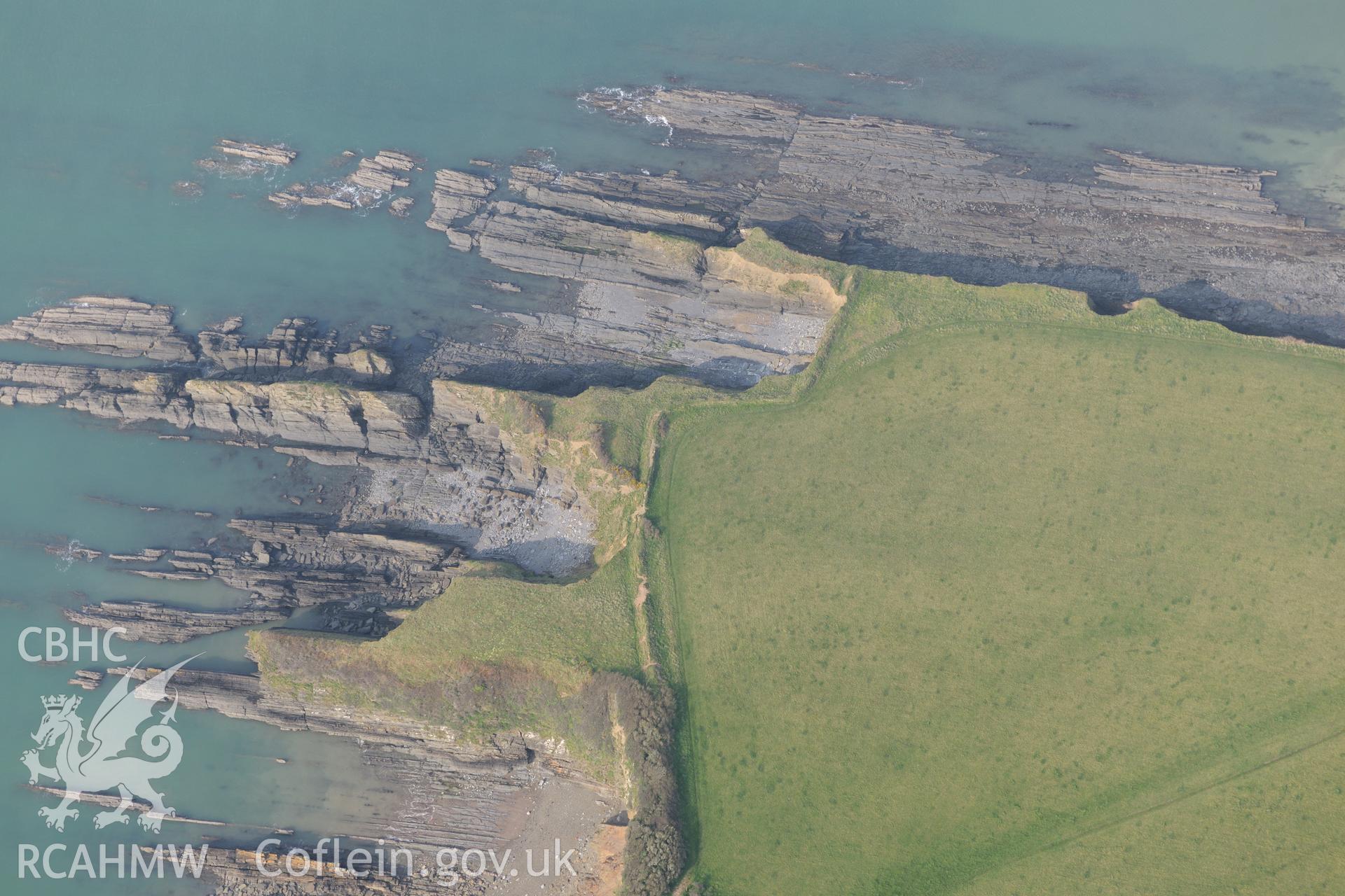 Royal Commission aerial photograph of West Angle Bay promontory fort taken on 27th March 2017. Baseline aerial reconnaissance survey for the CHERISH Project. ? Crown: CHERISH PROJECT 2017. Produced with EU funds through the Ireland Wales Co-operation Programme 2014-2020. All material made freely available through the Open Government Licence.