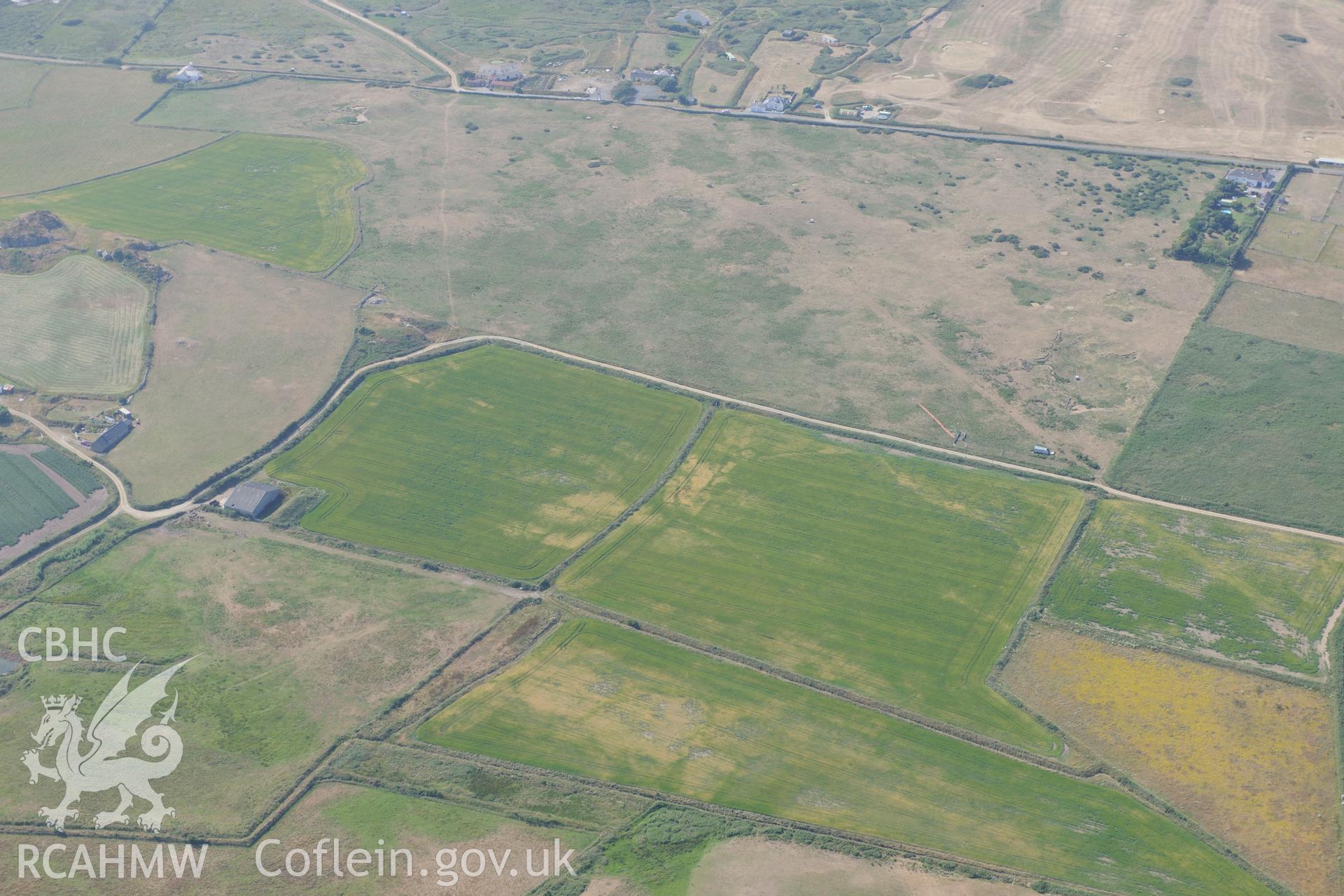 Parchmarks of possible township at Croes Phillip, St Davids. Oblique aerial photograph taken during the Royal Commission?s programme of archaeological aerial reconnaissance by Toby Driver on 16th July 2013.