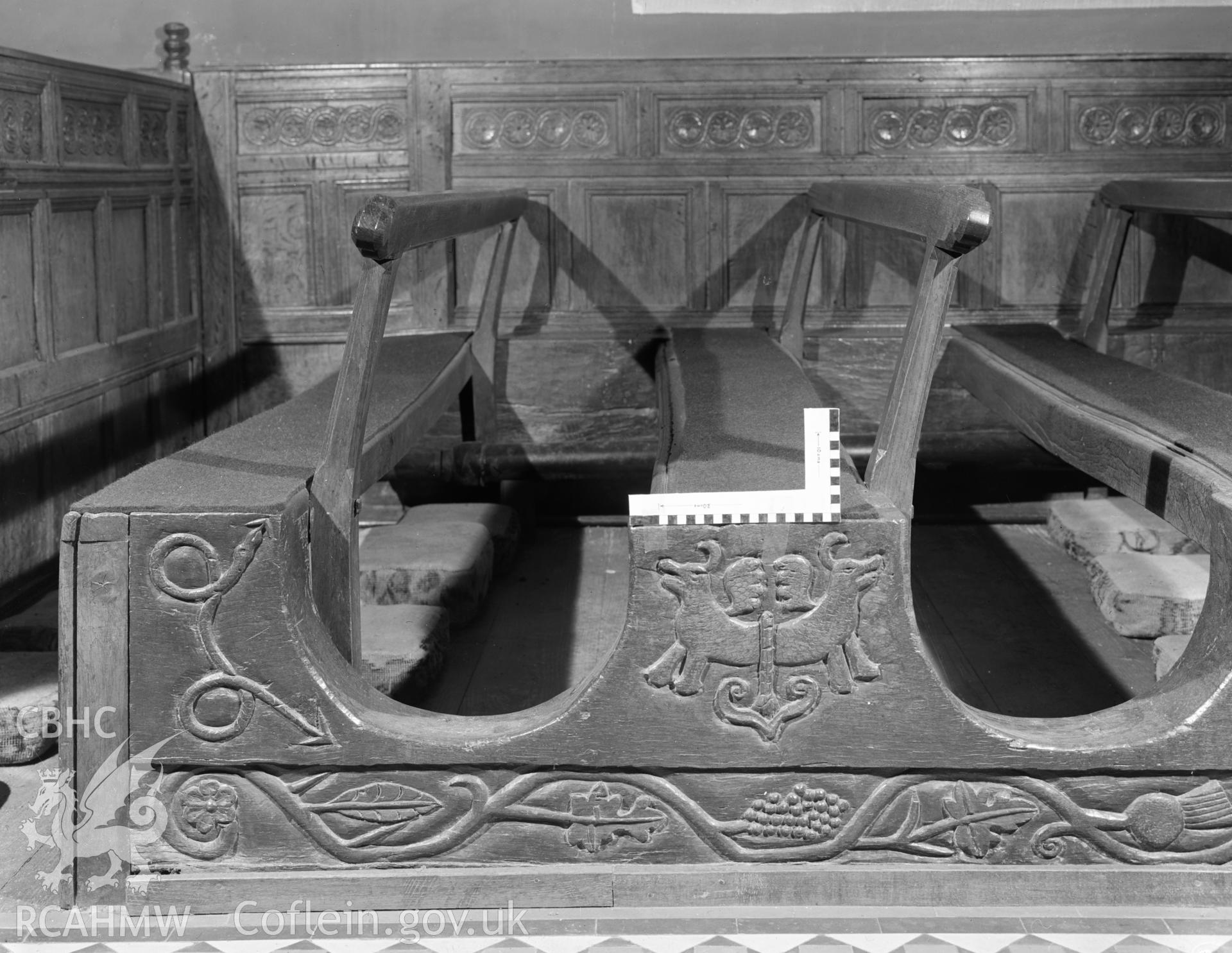 Digital copy of a black and white negative showing carved wooden pews at Rhug Chapel, taken by Department of Environment, 1976