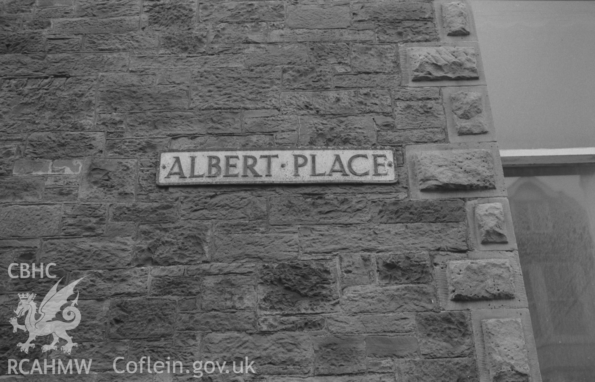 Digital copy of a black and white negative showing street name plaque on Albert Place, Aberystwyth. Photographed by Arthur O. Chater in September 1966.
