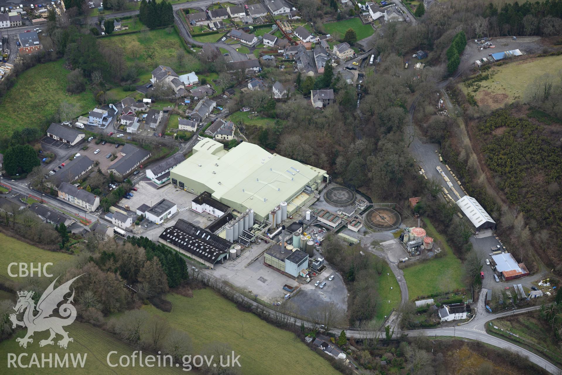 Site of the former Newcastle Emlyn Union Workhouse, now a large dairy operation. Oblique aerial photograph taken during the Royal Commission's programme of archaeological aerial reconnaissance by Toby Driver on 13th March 2015.