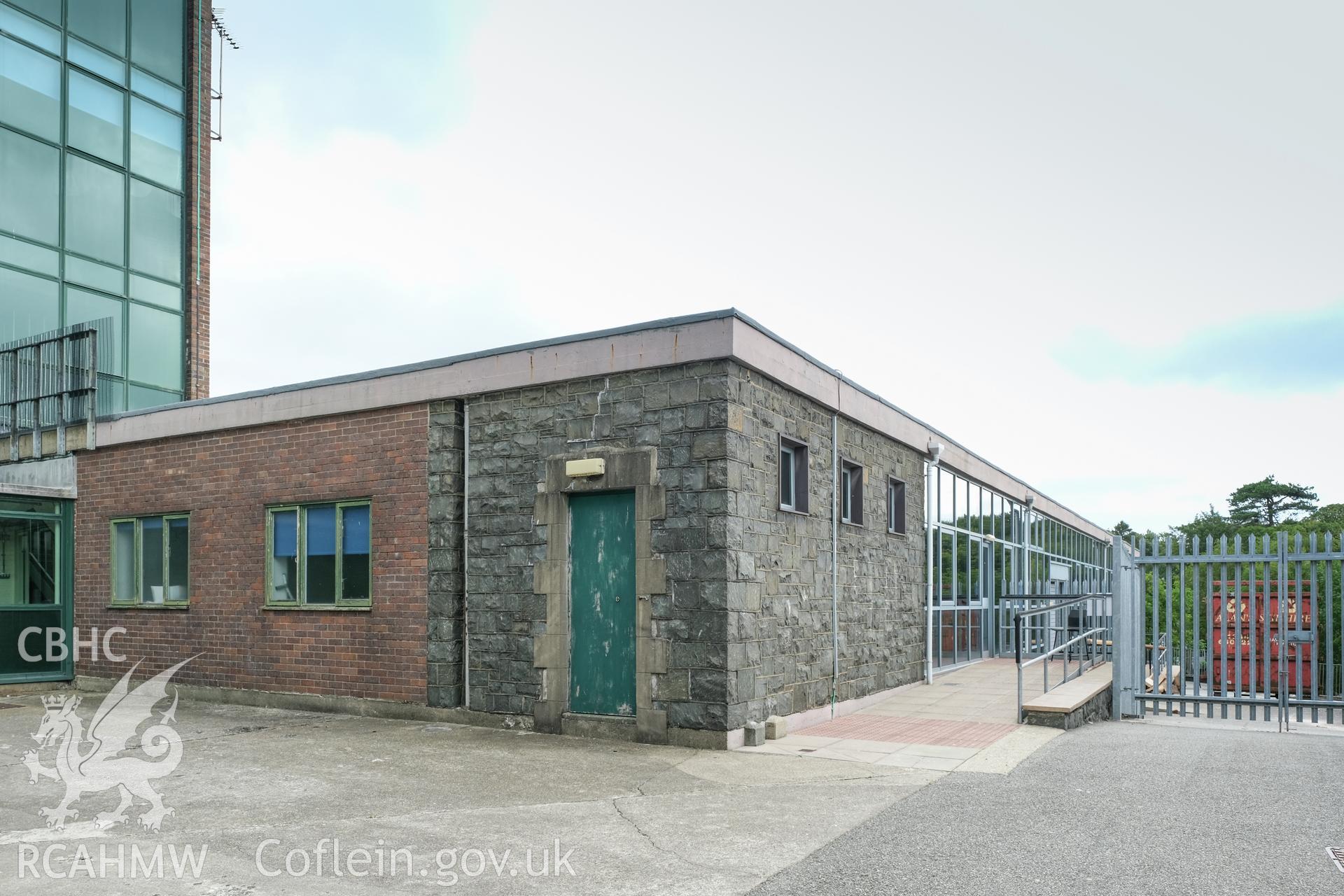 Digital colour photograph showing exterior view of single-storey part of building at Caernarfonshire Technical College, Ffriddoedd Road, Bangor. Photographed by Dilys Morgan, donated by Wyn Thomas of Grwp Llandrillo-Menai Further Education College, 2019.