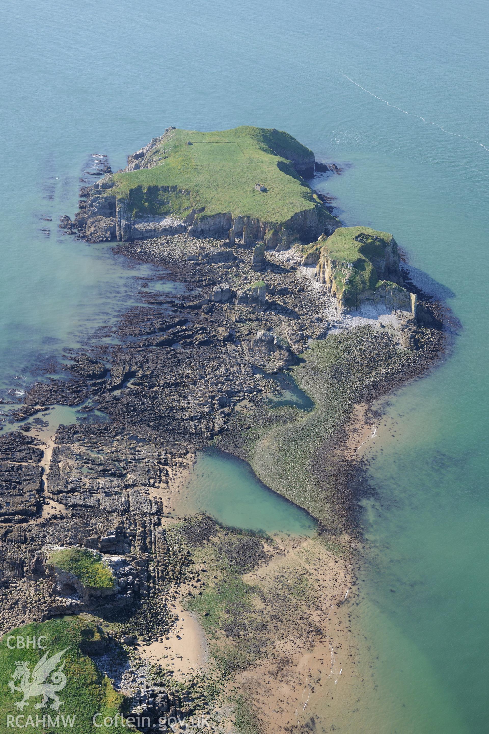 Monastic buildings, chapel ruins and field enclosure on St. Margaret's Island, with small sound to Caldey Island at low tide. Oblique aerial photograph taken during the RCAHMW?s programme of archaeological aerial reconnaissance by Toby Driver, 30/09/2015.