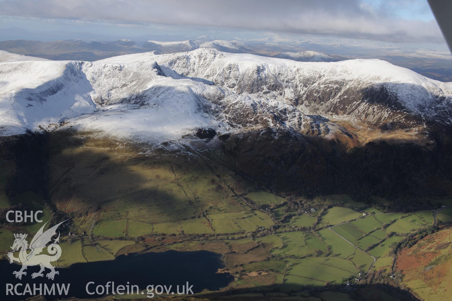 The snow-capped Cadair Idris, Penygadair Summit and Tal-y-Llyn lake, near Dolgellau. Oblique aerial photograph taken during the Royal Commission's programme of archaeological aerial reconnaissance by Toby Driver on 4th February 2015.