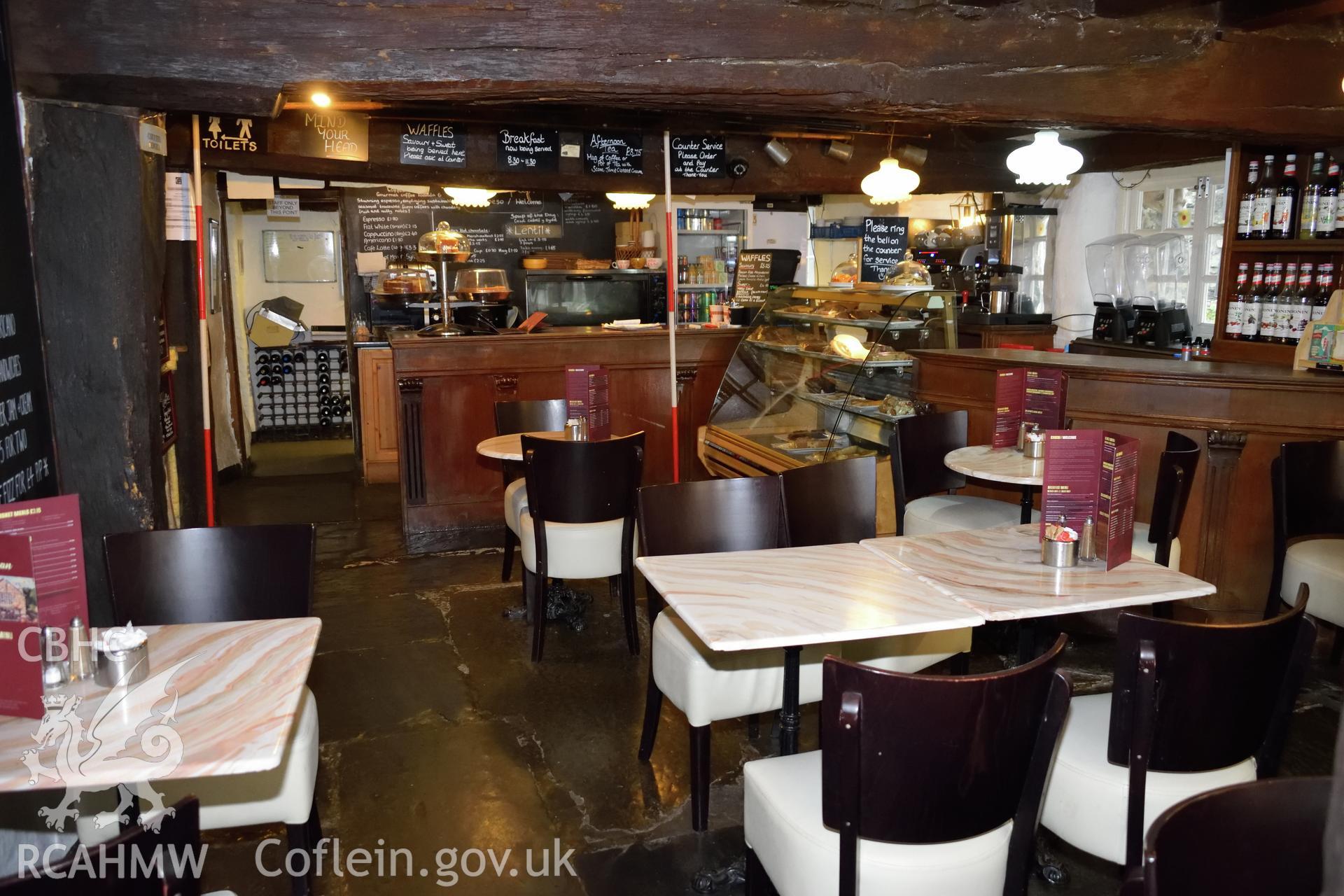 Colour photograph showing view looking west at the tearoom in Y Sospan, Llys Owain, Dolgellau. Photographed by I. P. Brookes of Engineering Archaeological Services, June 2019.