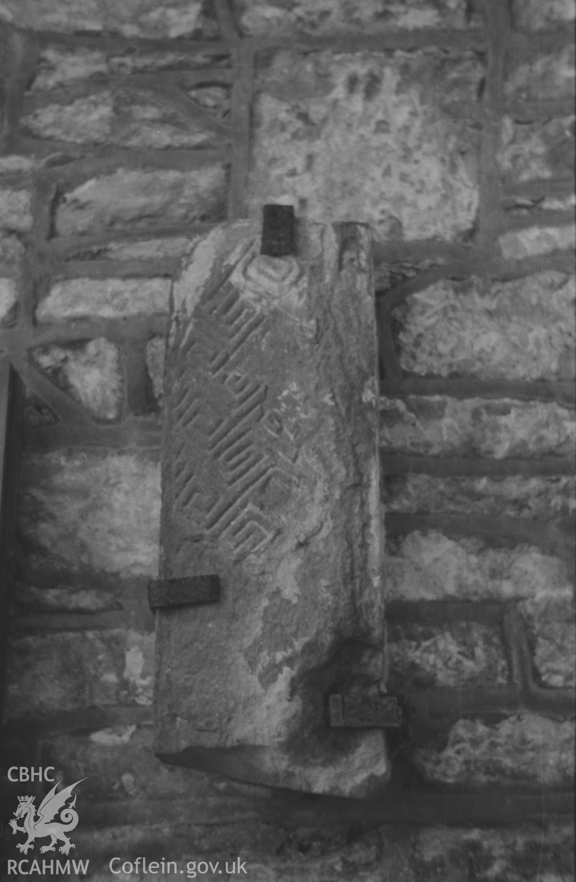 Digital copy of a black and white negative showing fragment of cross-shaft (?) of 9th-10th century inside porch at the west end of St. David's Church, Llanddewi Aberarth. Photographed by Arthur O. Chater on 5th September 1966. Stone is 26 x 9? x 3? inches.