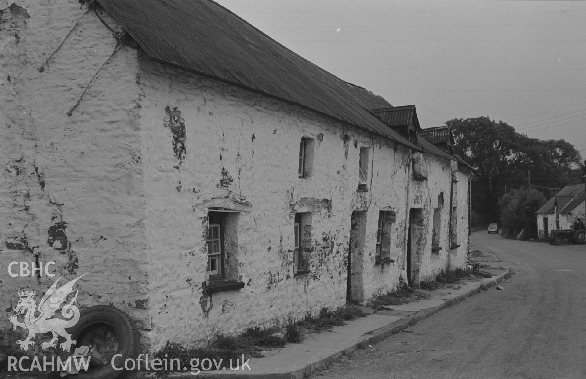 Digital copy of a black and white negative showing the old shop and cottages on east side of road at Talsarn, south east of Aberaeron. Photographed by Arthur O. Chater on 5th September 1966 looking south south west from Grid Reference SN 545 563.