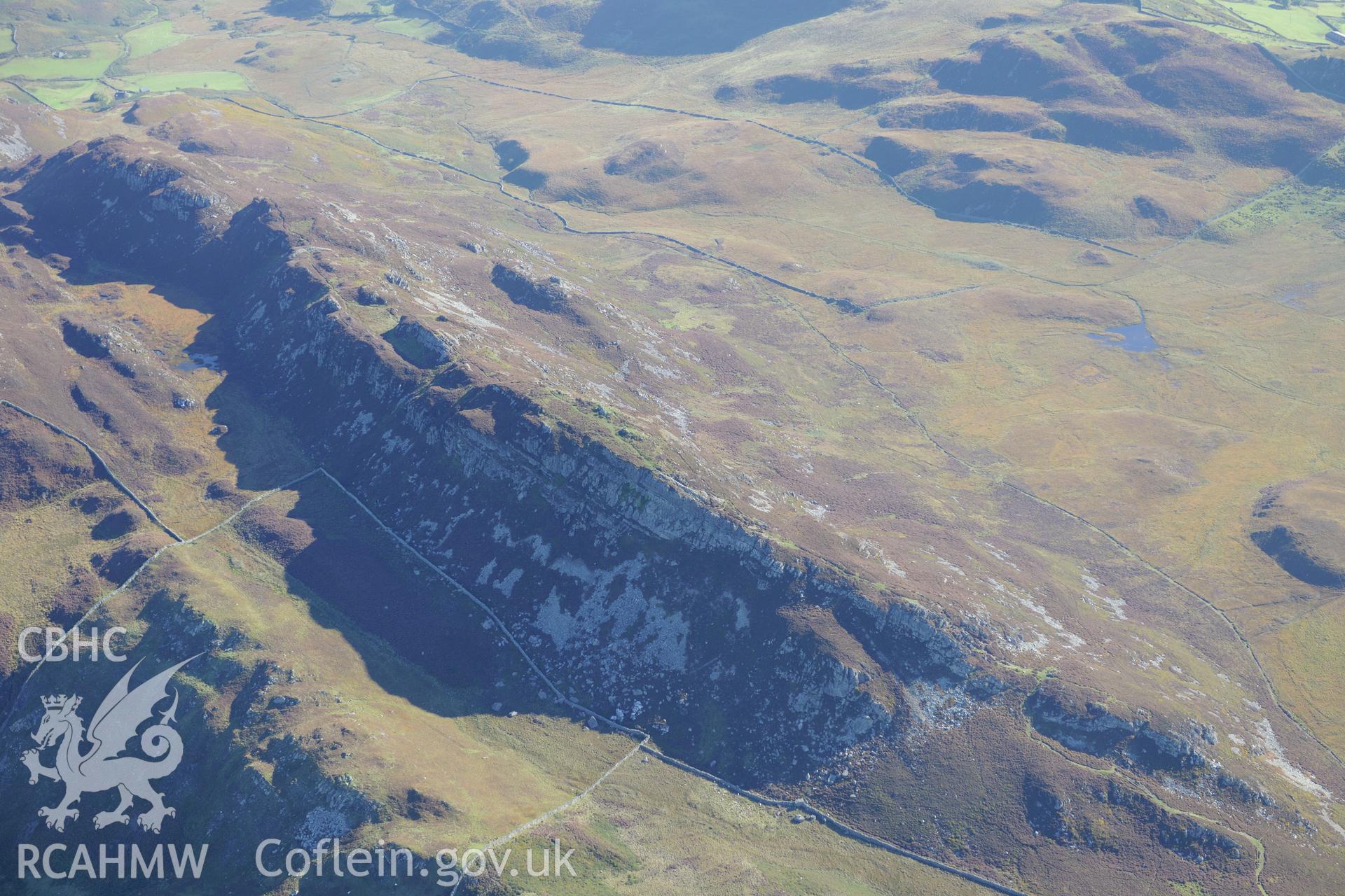 Pared y Cefnhir hillfort, about halfway between Dolgellau and Fairbourne. Oblique aerial photograph taken during the Royal Commission's programme of archaeological aerial reconnaissance by Toby Driver on 2nd October 2015.