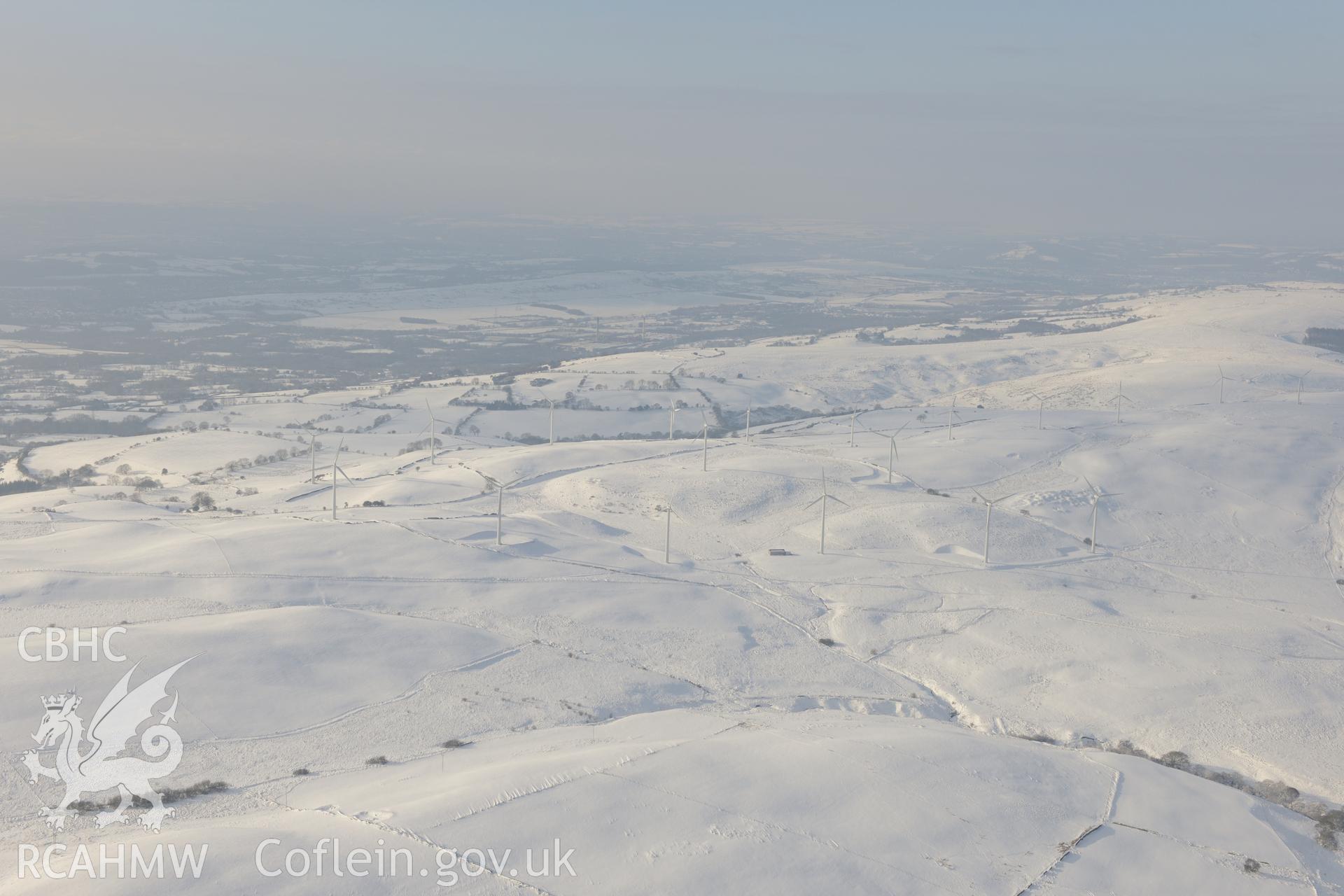 View from the east of Taff-Ely wind farm, Mynydd Maendy, north east of Bridgend. Oblique aerial photograph taken during the Royal Commission?s programme of archaeological aerial reconnaissance by Toby Driver on 24th January 2013.