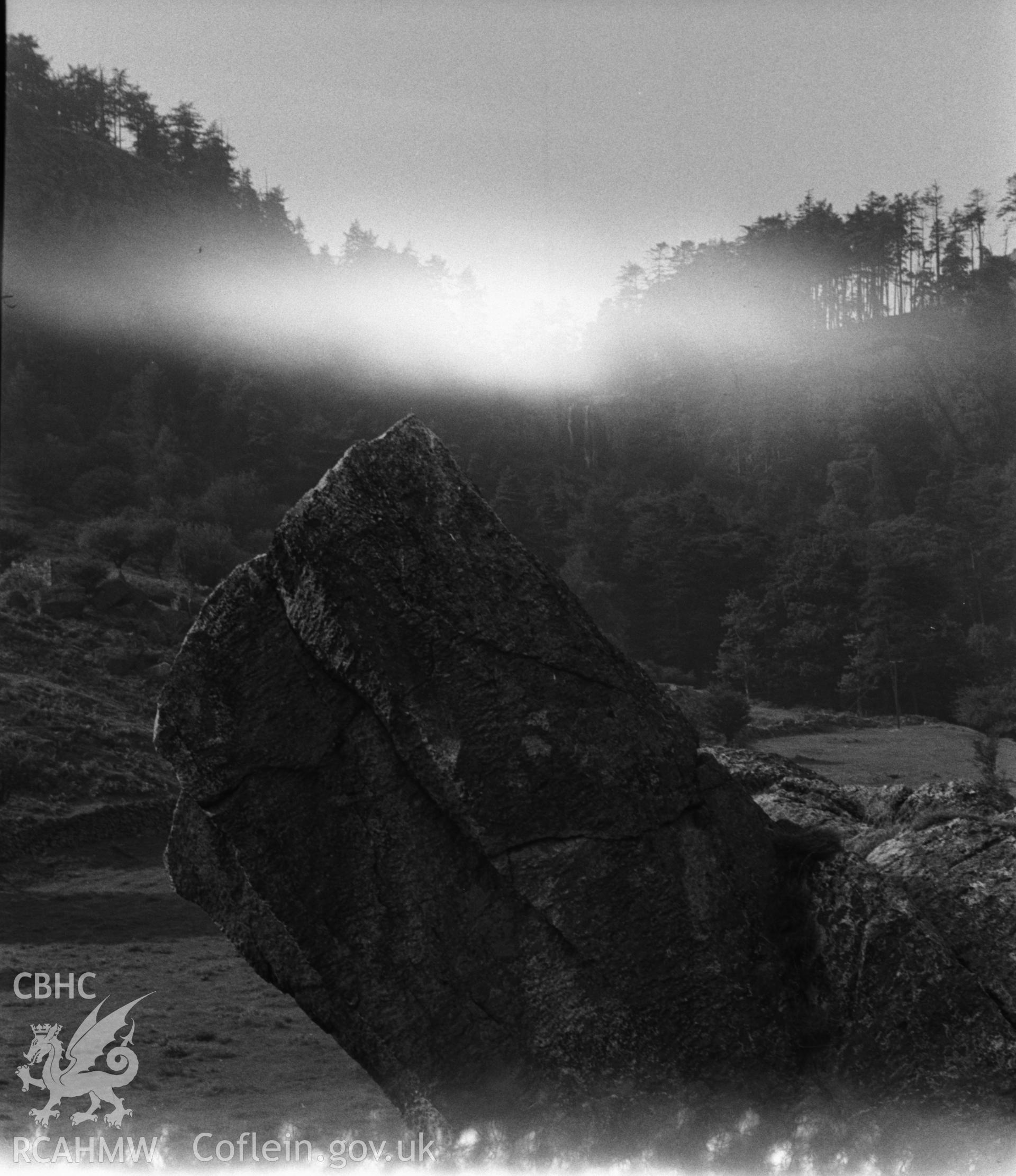 Digital copy of a black and white negative showing view of rock outcrop at Llanrhaeadr-ym-Mochnant. Photographed by Arthur O. Chater in September 1964.