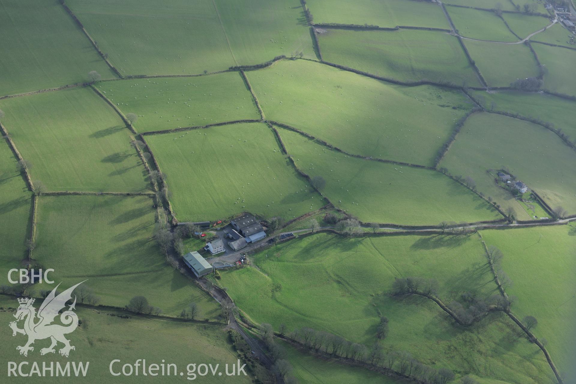 Pontcoy Farm, 700 metres south west of Silian village. Oblique aerial photograph taken during the Royal Commission's programme of archaeological aerial reconnaissance by Toby Driver on 6th January 2015.