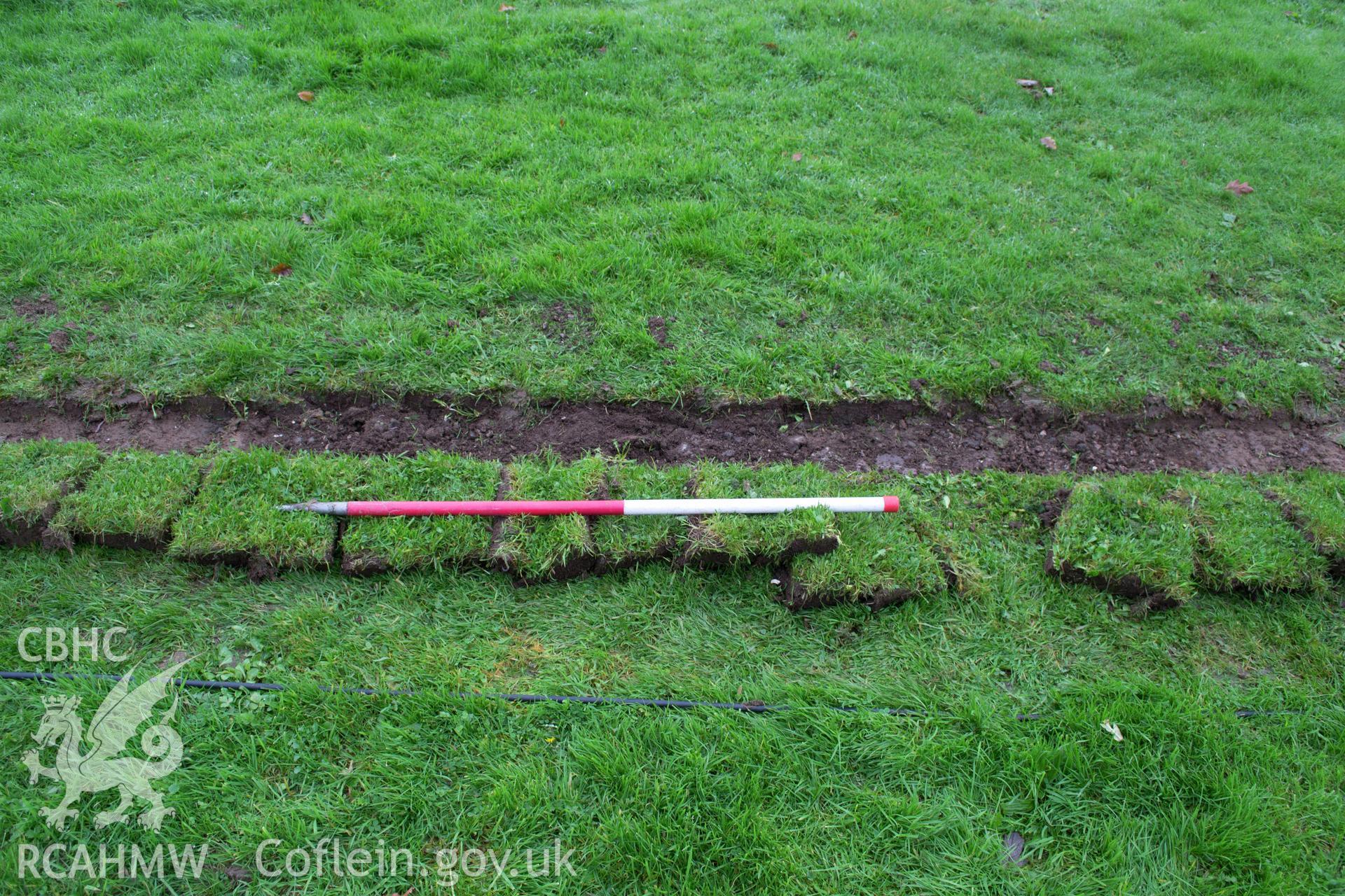 Detailed view from south of 0.3m wide trench area, showing modern service trench. Photographed during archaeological watching brief of Plas Newydd, Ynys Mon, conducted by Gwynedd Archaeological Trust on 14th November 2017. Project no. 2542.