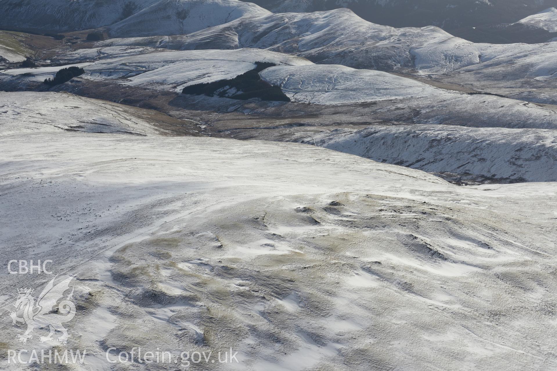 Cairn cemetery at Pen Pumlumon Arwystli, north west of Llangurig. Oblique aerial photograph taken during the Royal Commission's programme of archaeological aerial reconnaissance by Toby Driver on 4th February 2015.