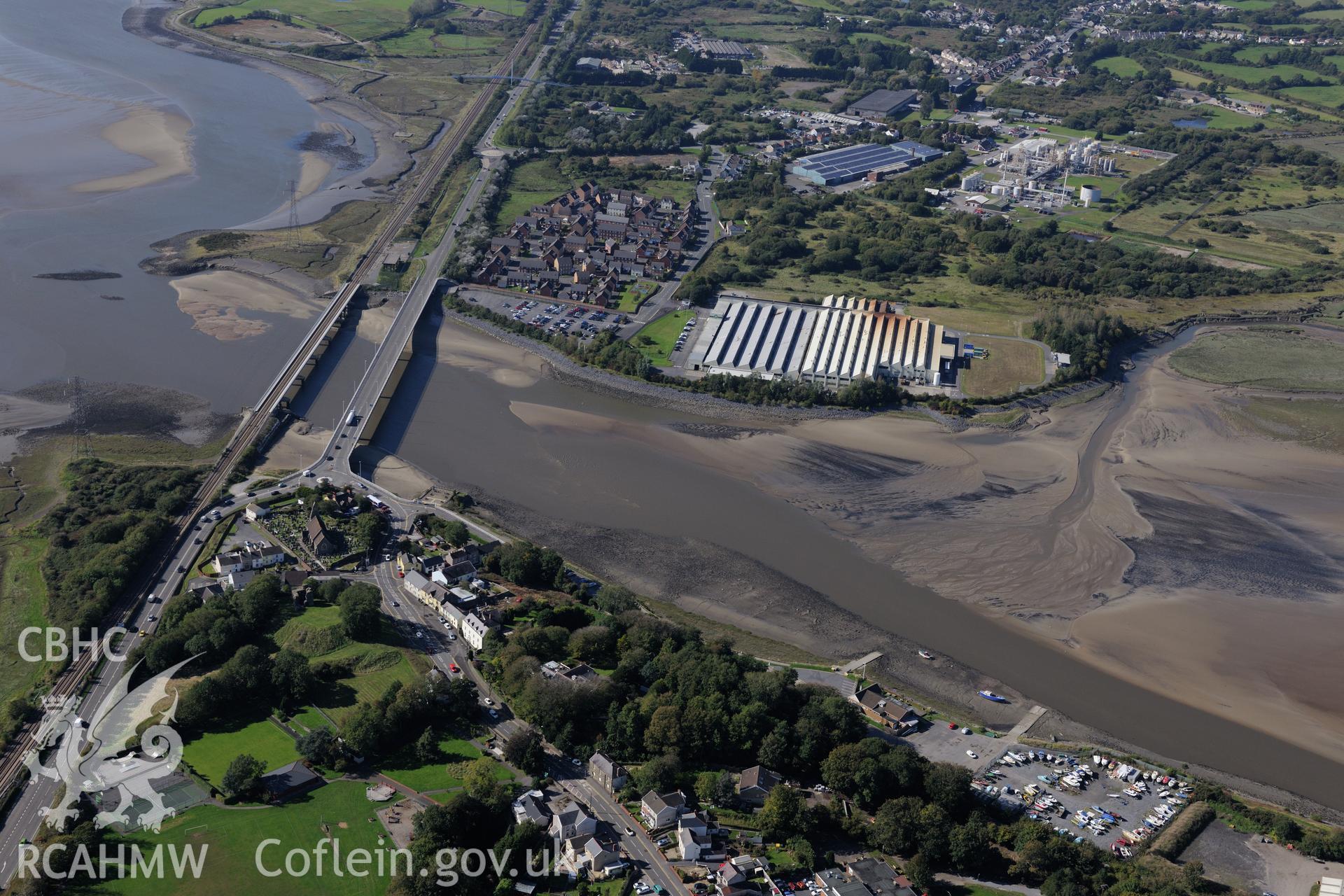 St. Michael's church and Loughor Castle; railway viaduct; road bridge; Roman Fort and Yspytty tin plate works, Loughor, between Llanelli and Swansea. Oblique aerial photograph taken during the Royal Commission's programme of archaeological aerial reconnaissance by Toby Driver on 30th September 2015.