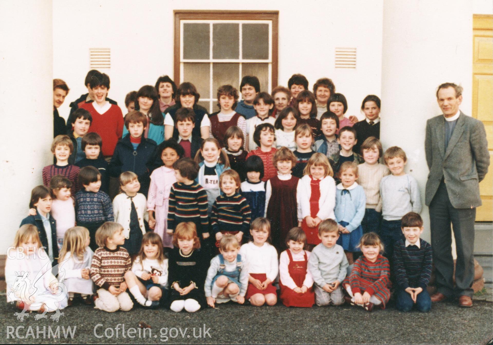 Colour photograph of those that attended sponsored walk to raise money for a new carpet for the vestry, 1984. The minister was Mr Griffiths. Many of the children still live in the area. Donated as part of the Digital Dissent Project.