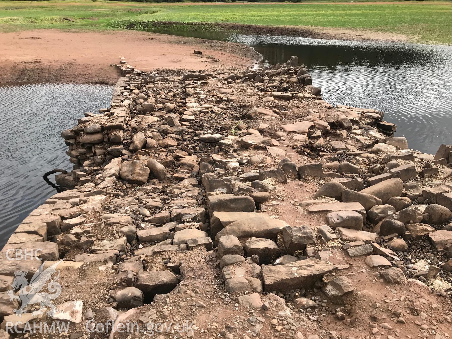 Pont ar Daf - usually submerged by the Llwyn-on reservoir but revealed during the drought conditions of the summer of 2018. Colour photograph taken by Paul R. Davis on 25th August 2018.