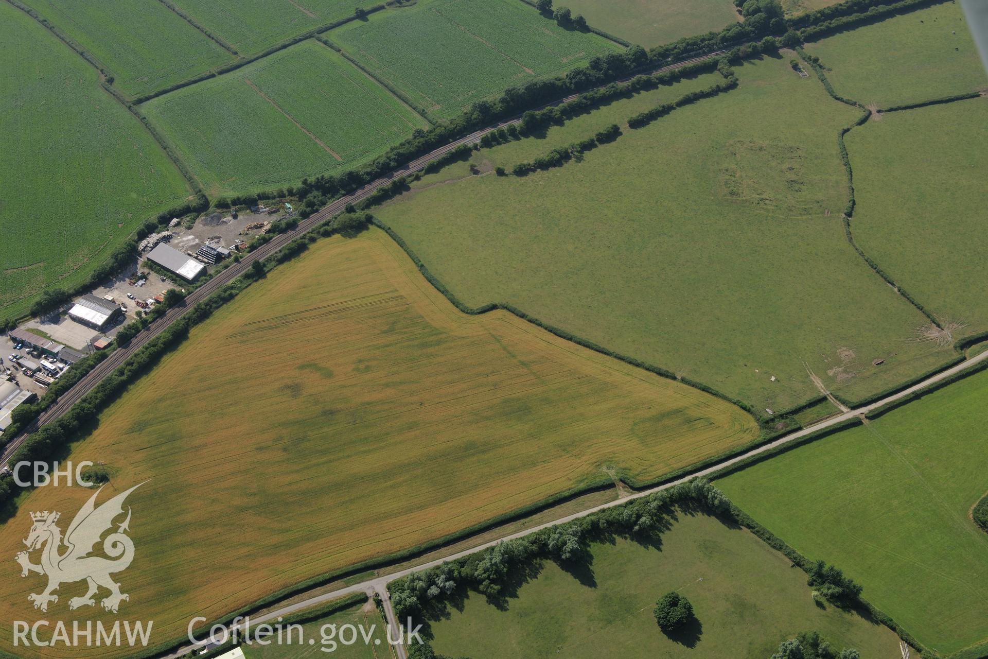 Caermead Roman villa and Morfa Lane cropmark enclosure, Caermead, north west of Llantwit Major. Oblique aerial photograph taken during the Royal Commission?s programme of archaeological aerial reconnaissance by Toby Driver on 1st August 2013.