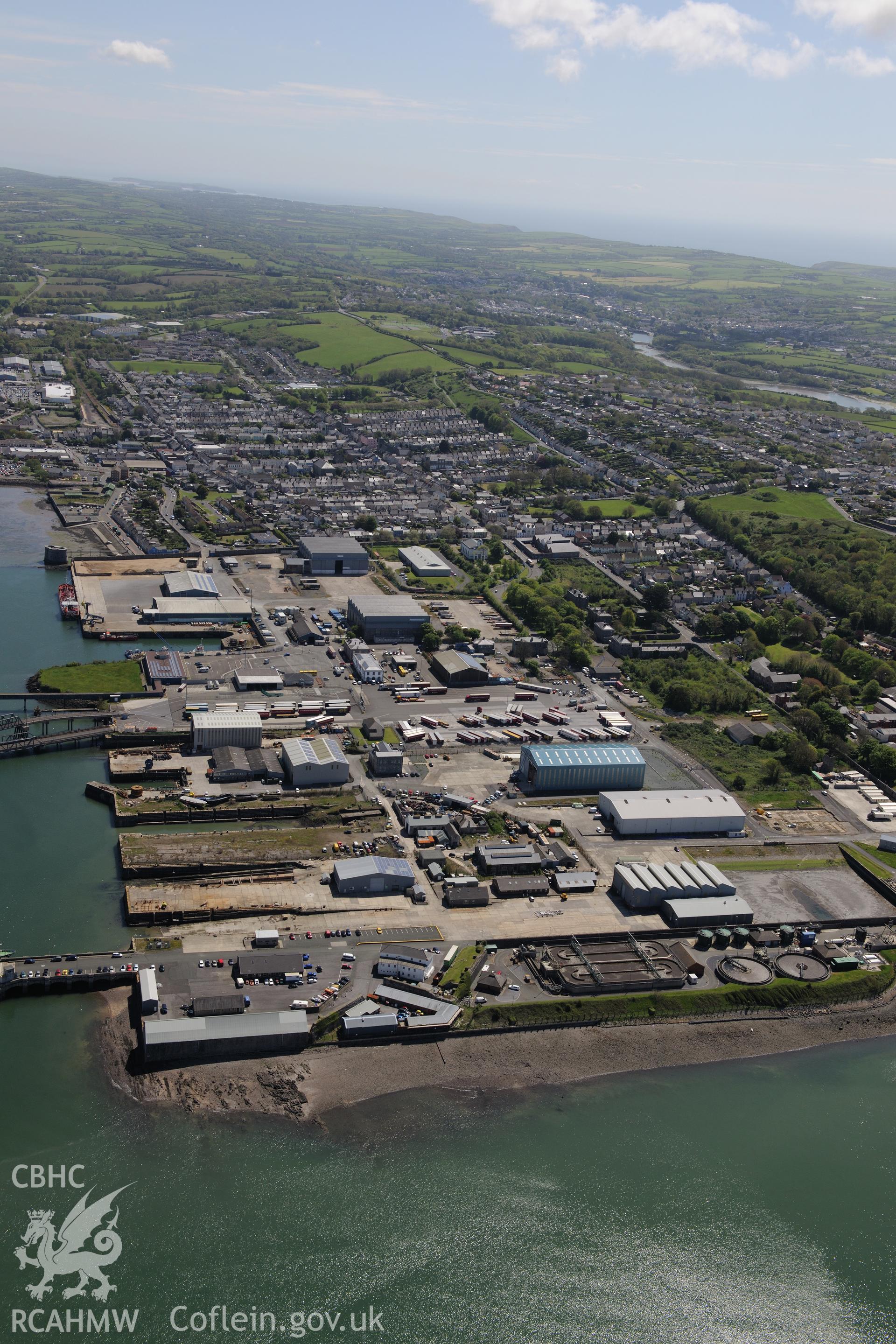 Pembroke Royal Dockyard and the dry dock at Pembroke Dockyard, Pembroke Dock. Oblique aerial photograph taken during the Royal Commission's programme of archaeological aerial reconnaissance by Toby Driver on 13th May 2015.