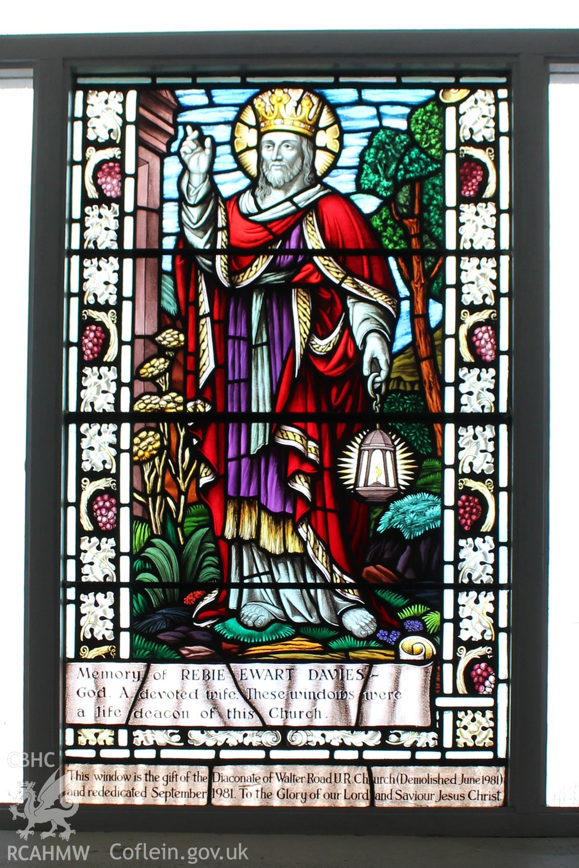 Colour photograph showing detail of stained glass window donated by the Daconate of Walter Road U.R. Church (Demolished June 1981) at Mynydd Bach Independent Chapel. Taken during photographic survey conducted by Sue Fielding on 13th May 2017.