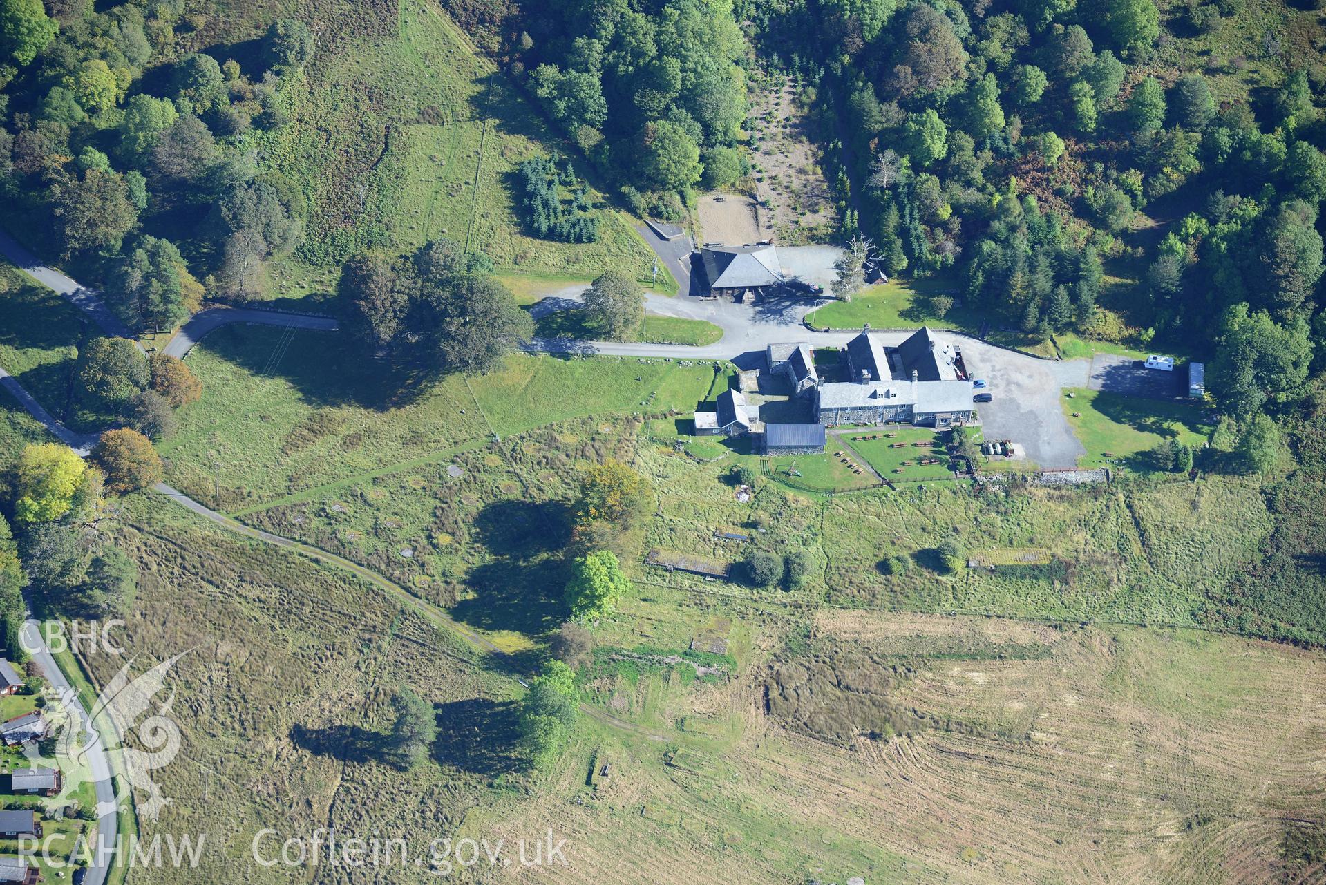Circular tent bases at the former Trawsfynydd military camp, and Rhiw Goch house, Bronaber. Oblique aerial photograph taken during the Royal Commission's programme of archaeological aerial reconnaissance by Toby Driver on 2nd October 2015.