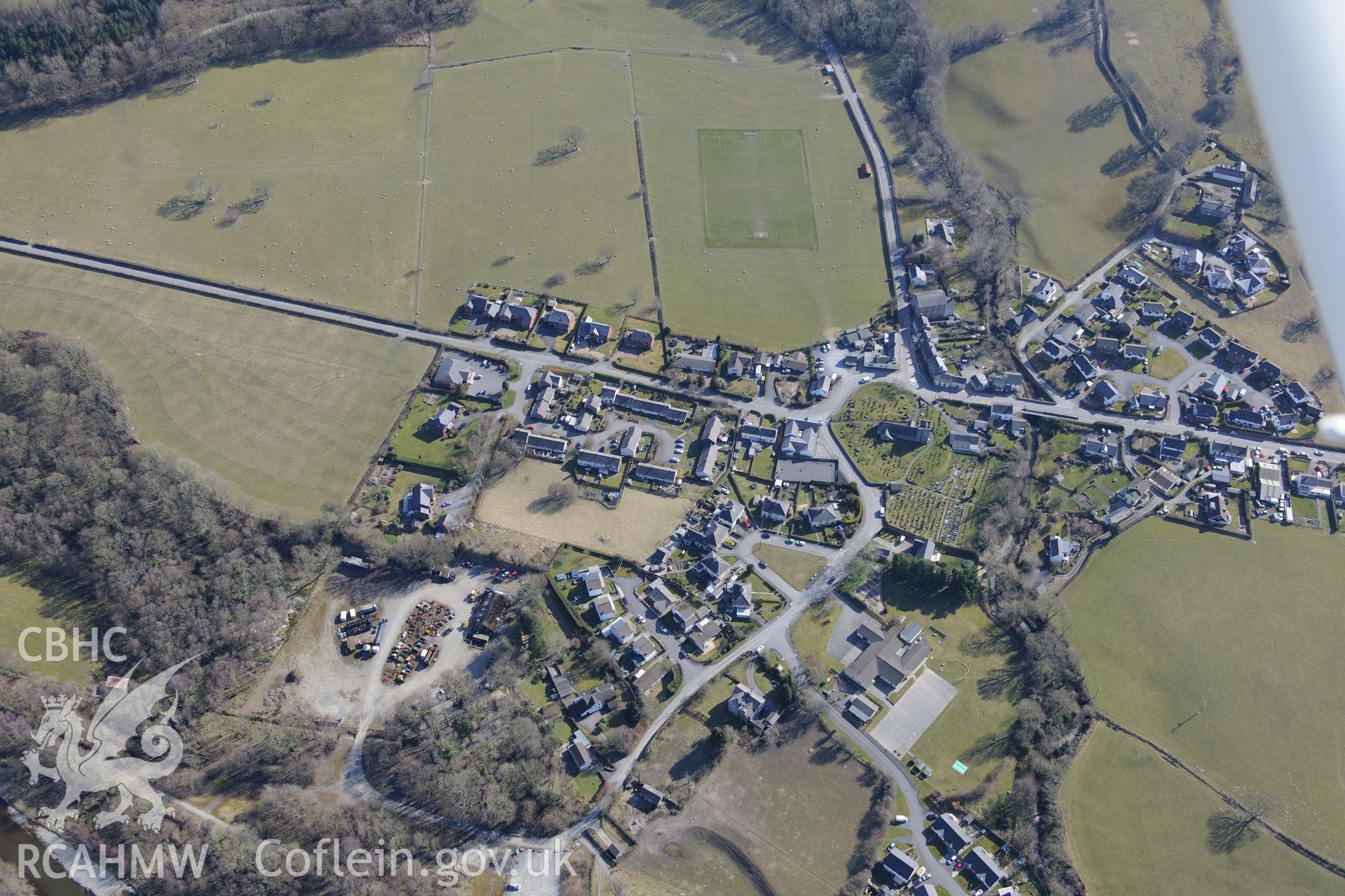 The village of Llanilar, south east of Aberystwyth, with St. Hilary's church at it's centre. Oblique aerial photograph taken during the Royal Commission?s programme of archaeological aerial reconnaissance by Toby Driver on 2nd April 2013.