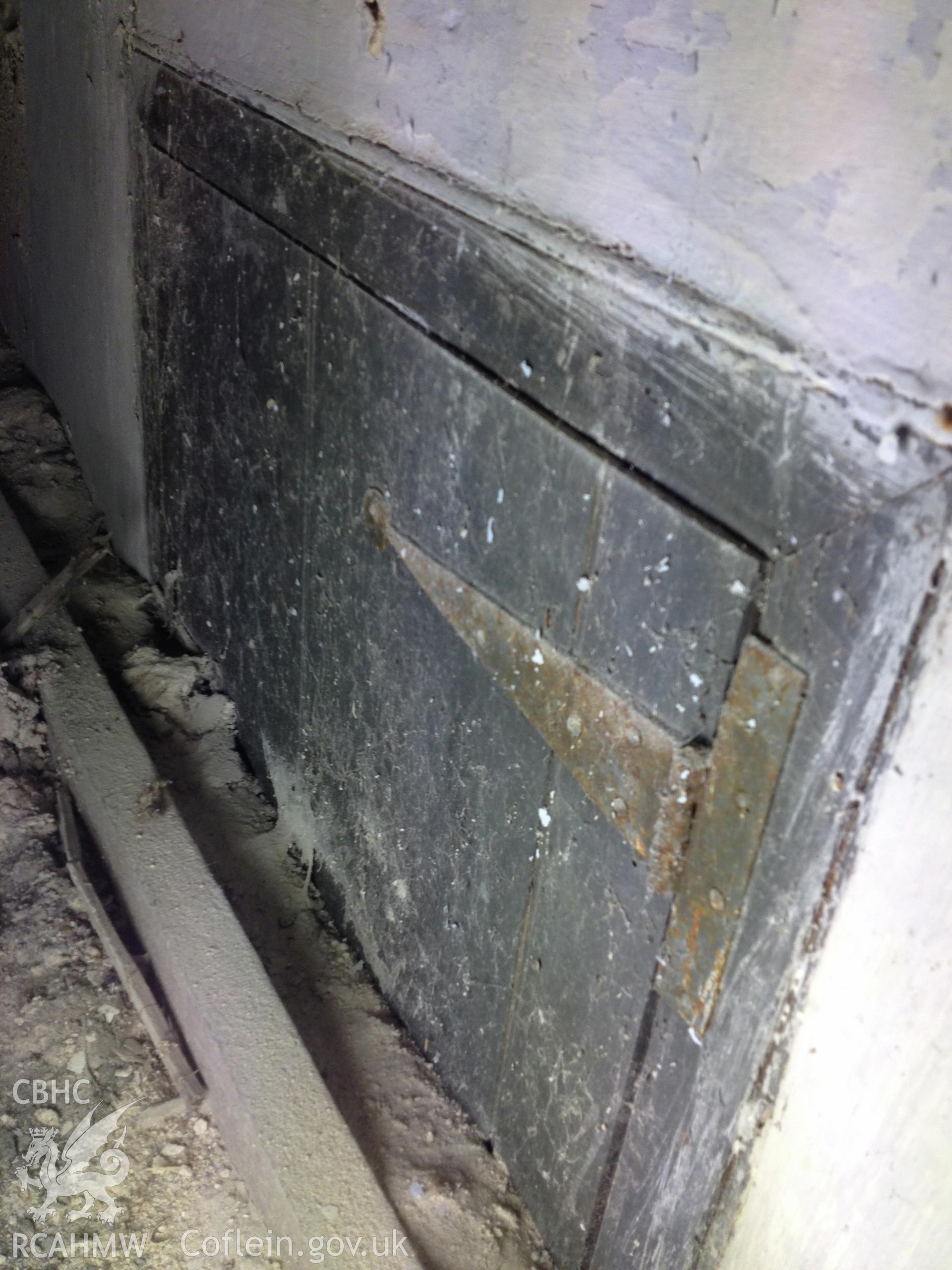 Historic door partially sealed by floor in attic 1 of the house at Pencerrig Pellaf, Ffordd Uchaf, Harlech. Photographed by Kimberley Urch as part of photographic survey for planning application (ref. no. NP5/61/LB446A Snowdonia National Park Authority).