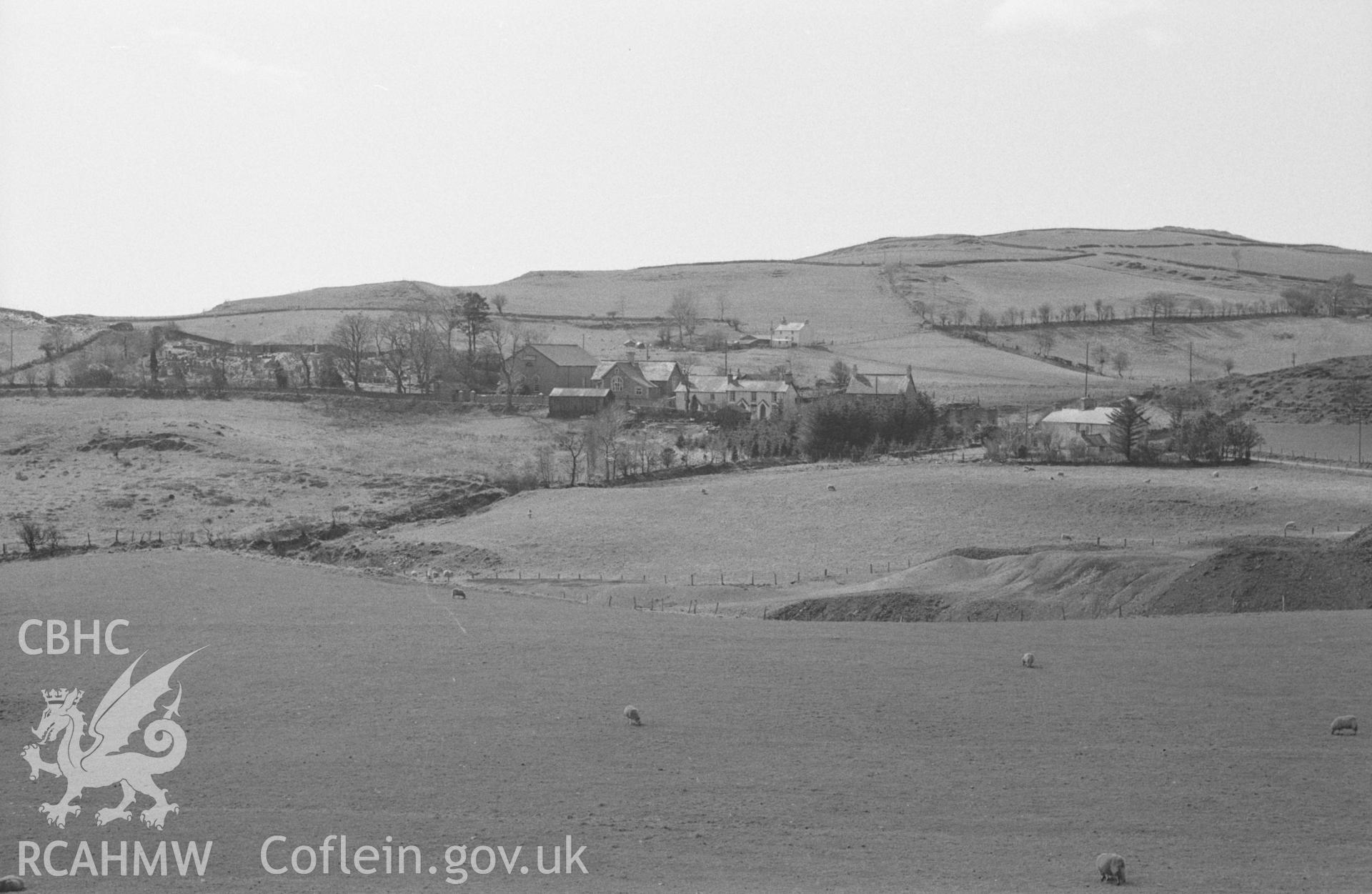 Digital copy of a black and white negative showing view of Ystumtuen village, north of Devil's Bridge. Photographed in April 1964 by Arthur O. Chater from the lane just south of the mine, Grid Reference SN 7383 7869, looking west south west.