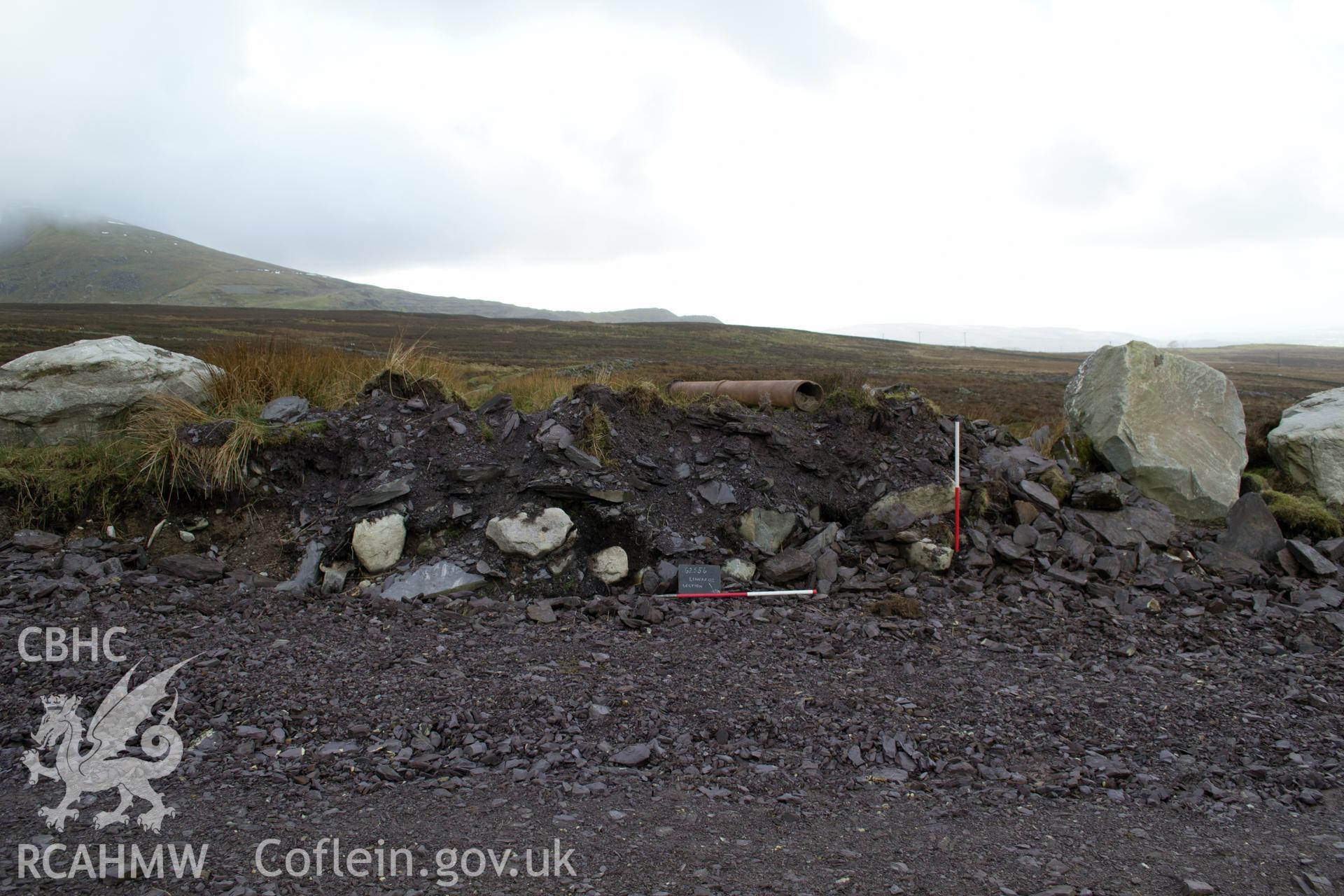 General view from the north north west 'of section through Linear 02 where cut by trackway.' Photographed by Gwynedd Archaeological Trust as part of walkover survey of Penrhyn Quarry, Bethesda, on 20th February 2018. Project no. G2556.
