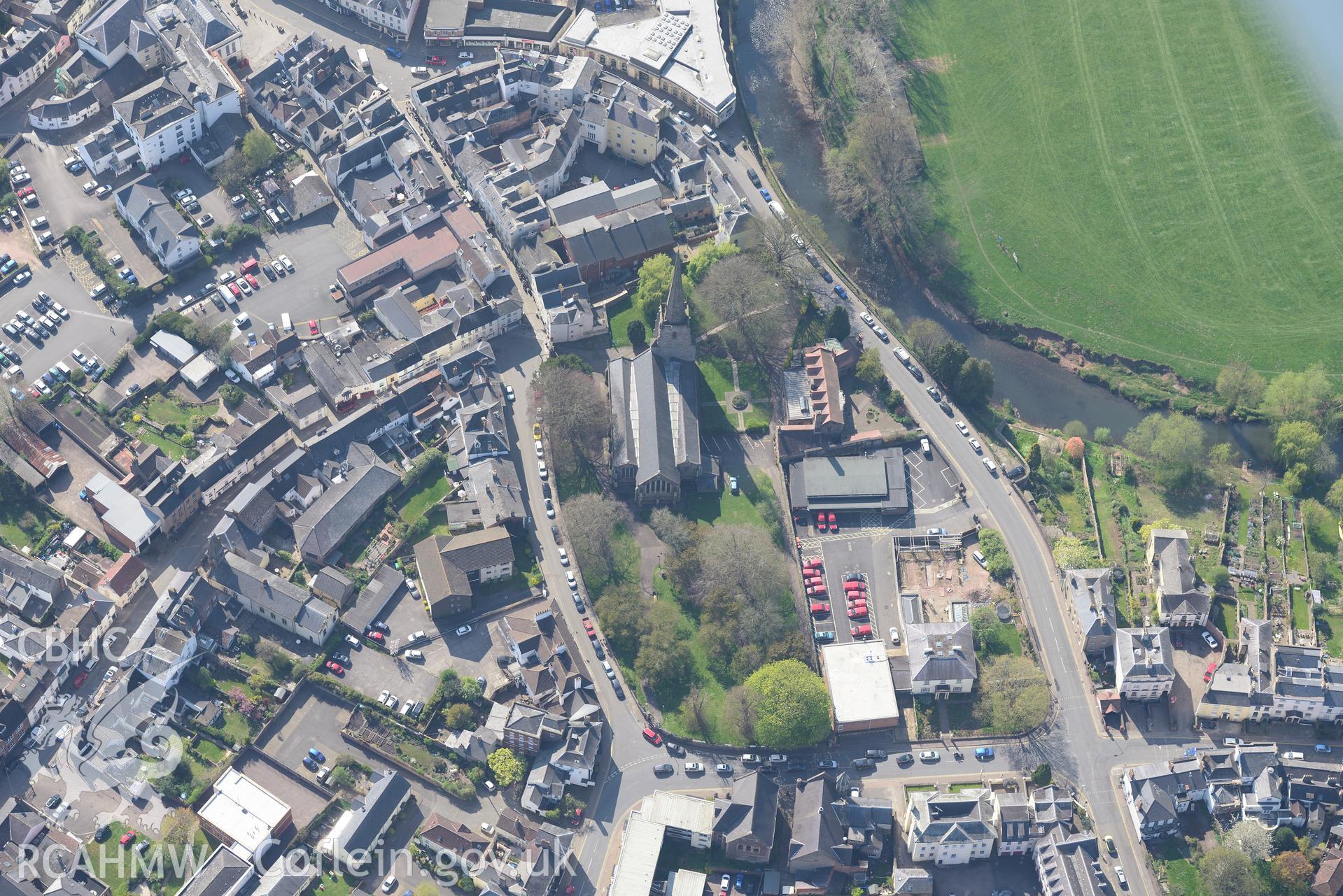 Monmouth including views of St. Mary and the Virgin Church; Baptist Chapel; Market Hall; Royal George Hotel and Priory Street Boys School. Oblique aerial photograph taken during the Royal Commission's programme of archaeological aerial reconnaissance by Toby Driver on 15th April 2015.