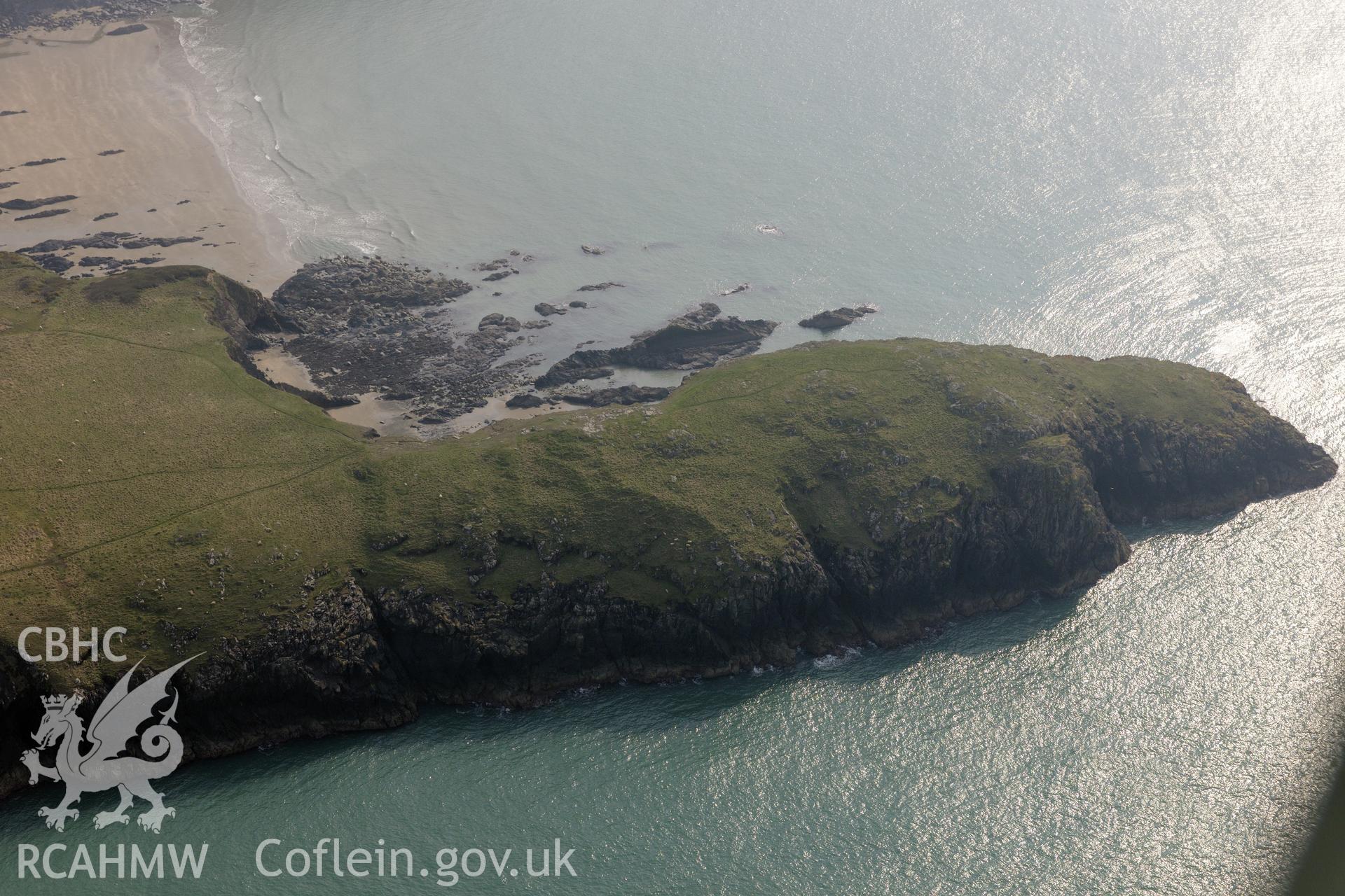 Aerial photography of Porth Egr promontory fort taken on 27th March 2017. Baseline aerial reconnaissance survey for the CHERISH Project. ? Crown: CHERISH PROJECT 2017. Produced with EU funds through the Ireland Wales Co-operation Programme 2014-2020. All material made freely available through the Open Government Licence.