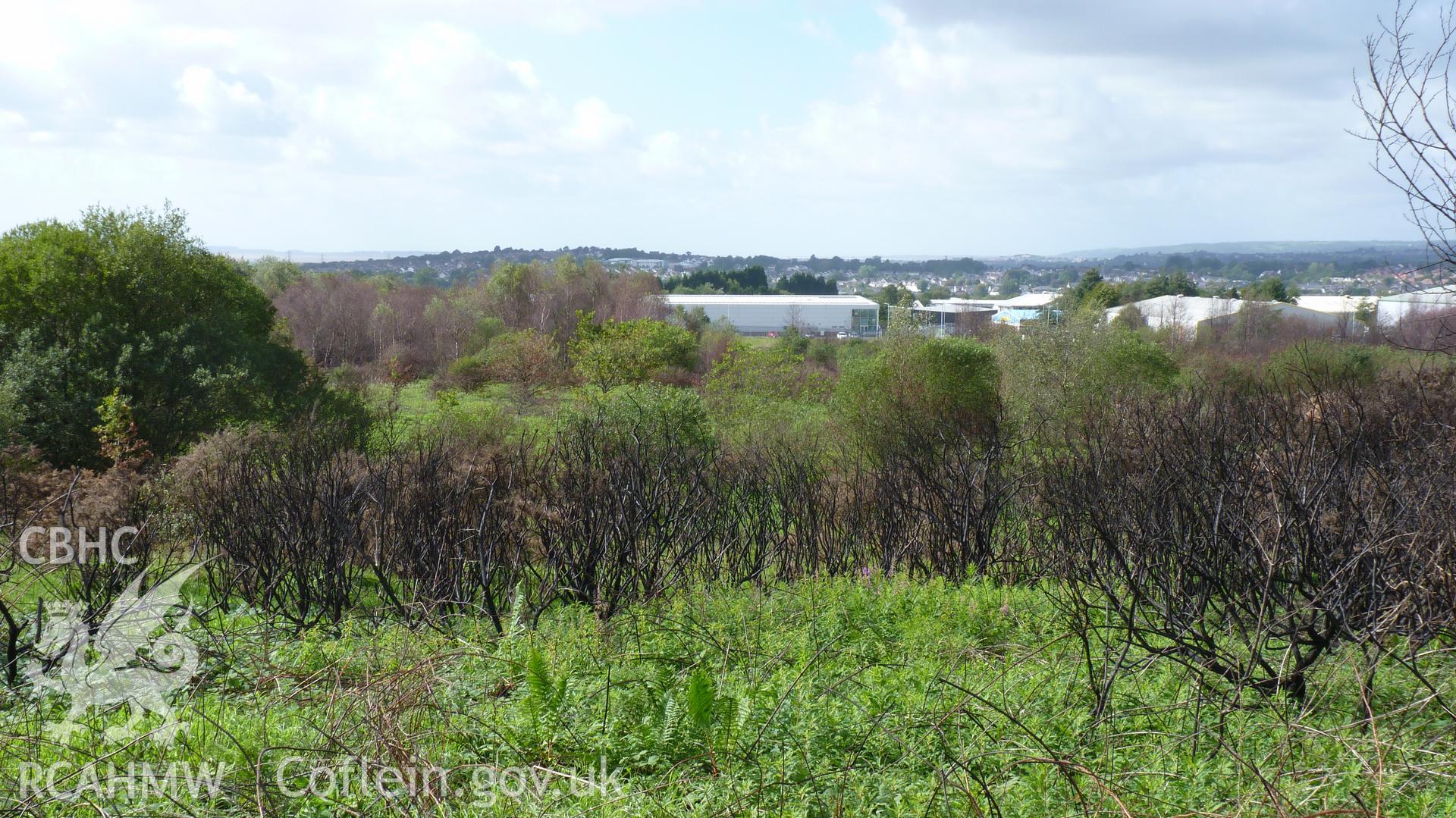 View west towards Carn Goch Industrial Estate. Photographed during Setting Impact Assessment of Land off Phoenix Way, Garngoch Business Village, Swansea, carried out by Archaeology Wales, 2018. Project number P2631.