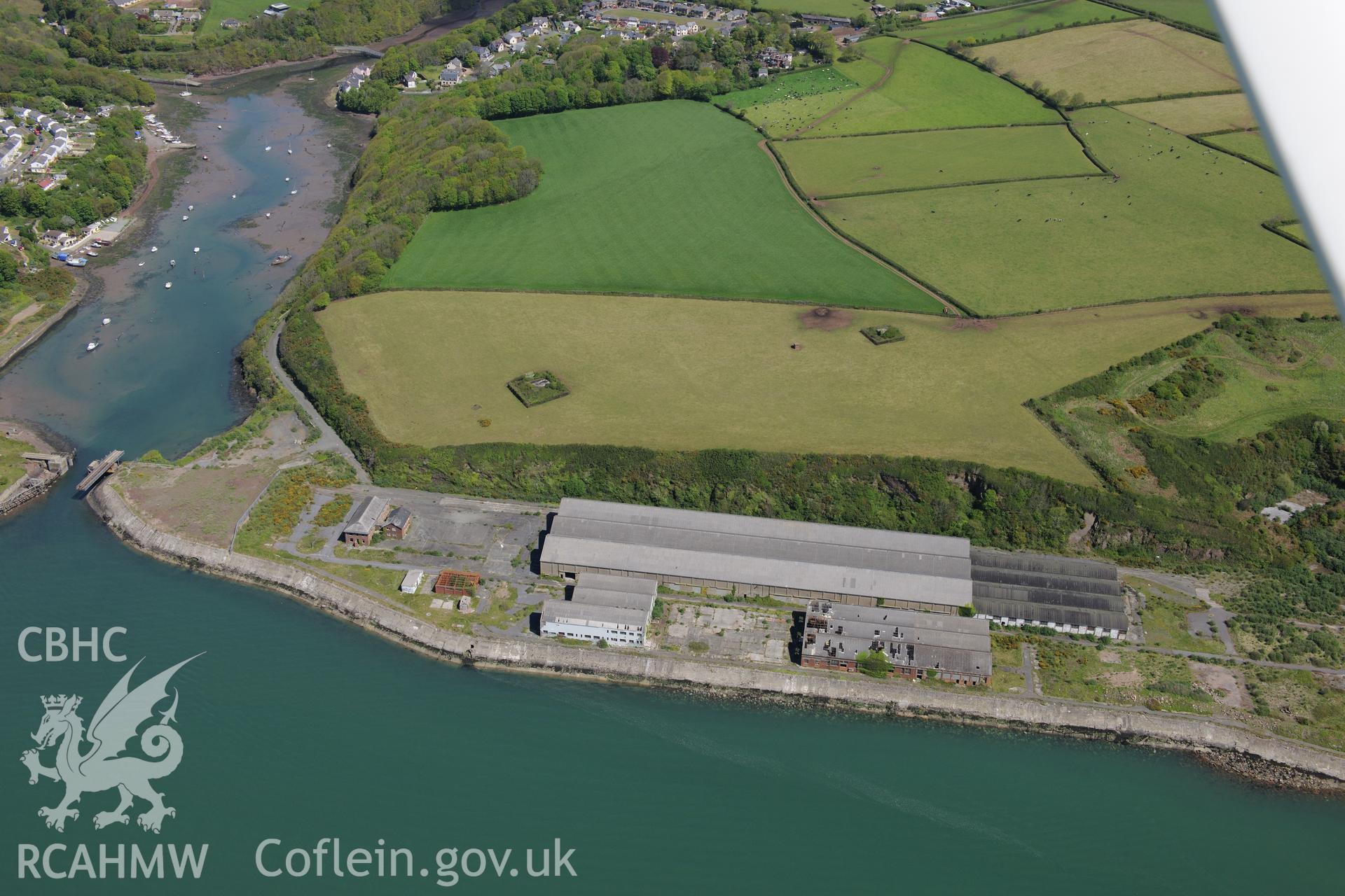 Castle Pill railway bridge; Royal Naval Armaments Depot and the site of Thomas Ward's ship breaking yard, Milford Haven. Oblique aerial photograph taken during the Royal Commission's programme of archaeological aerial reconnaissance by Toby Driver on 13th May 2015.