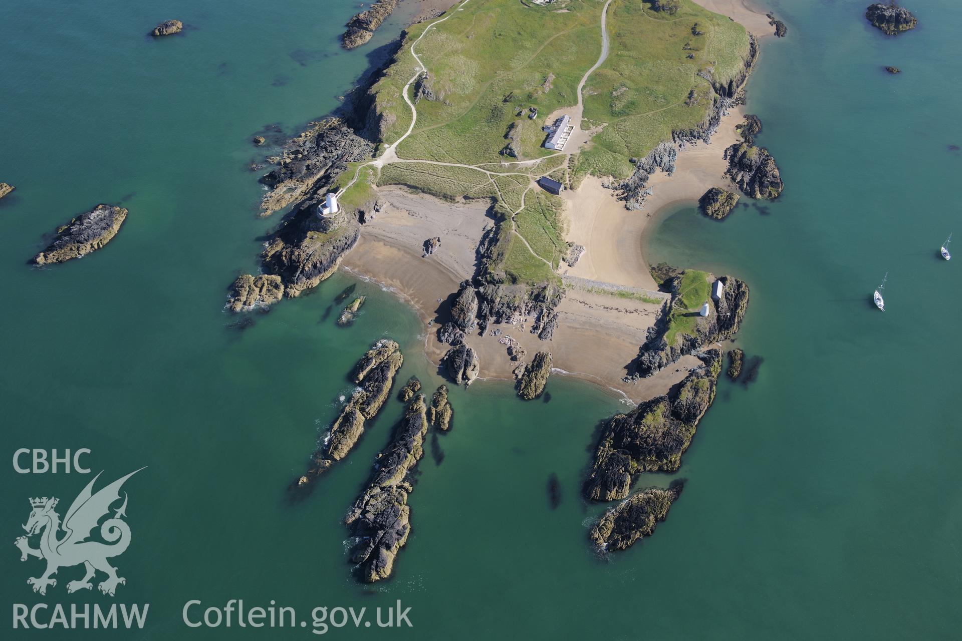 The lighthouse, tower, and pilot's house on Llanddwyn Island. Oblique aerial photograph taken during the Royal Commission's programme of archaeological aerial reconnaissance by Toby Driver on 23rd June 2015.