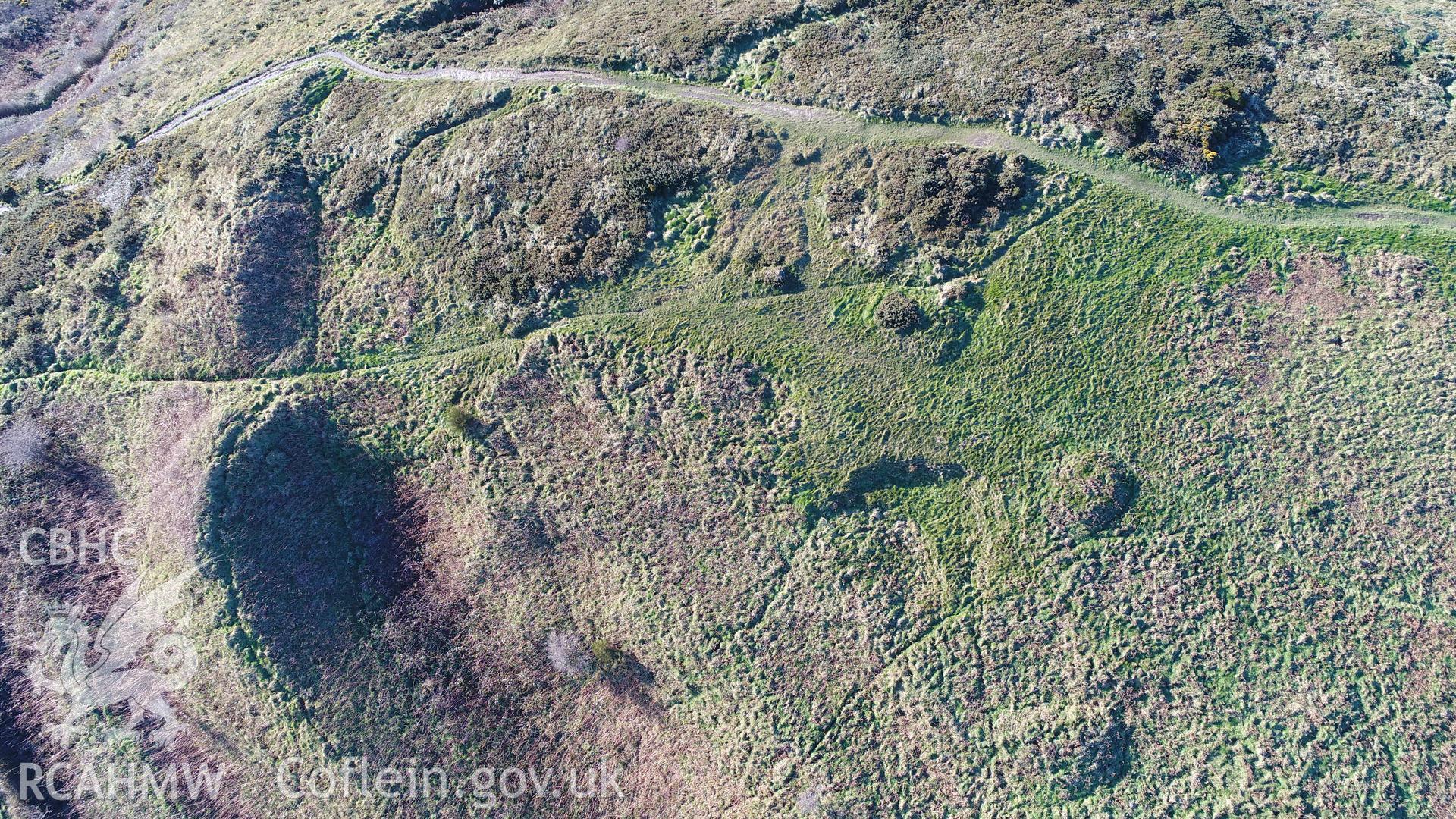 View of south gate of south fort. CHERISH Project DJI drone photo survey of Pen Dinas Hillfort and the Wellington Monument. ? Crown: CHERISH PROJECT 2017. Produced with EU funds through the Ireland Wales Co-operation Programme 2014-2020. All material made freely available through the Open Government Licence.