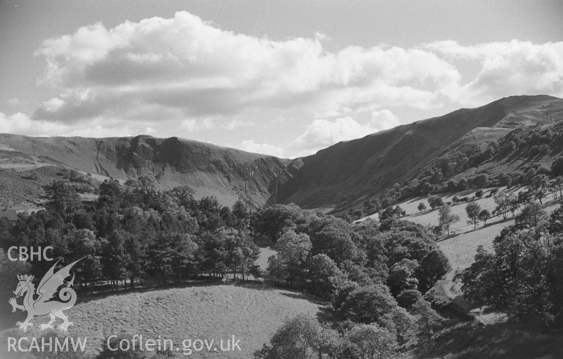 Digital copy of a black and white negative showing view of Cwm Rhaiadr, south of Machynlleth. Photographed by Arthur O. Chater in September 1965 from Gallt-y-Bladur, Grid Reference SN 7533 9652, looking south.