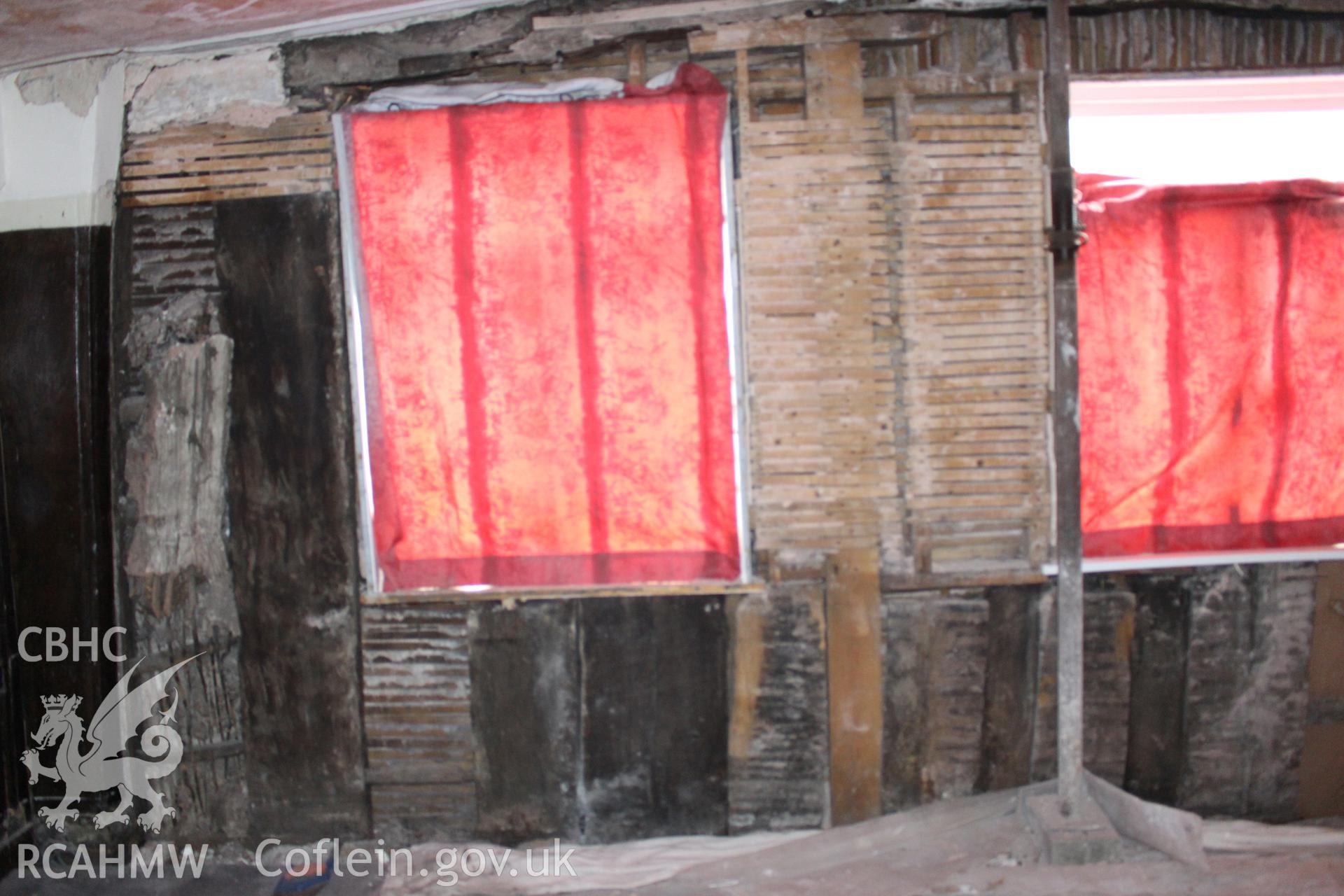 Colour photograph showing interior view of wattle and daub wall at Porth y Dwr, Clwyd Street, Ruthin. Photograph taken during survey conducted by Geoff Ward on 9th October 2014.