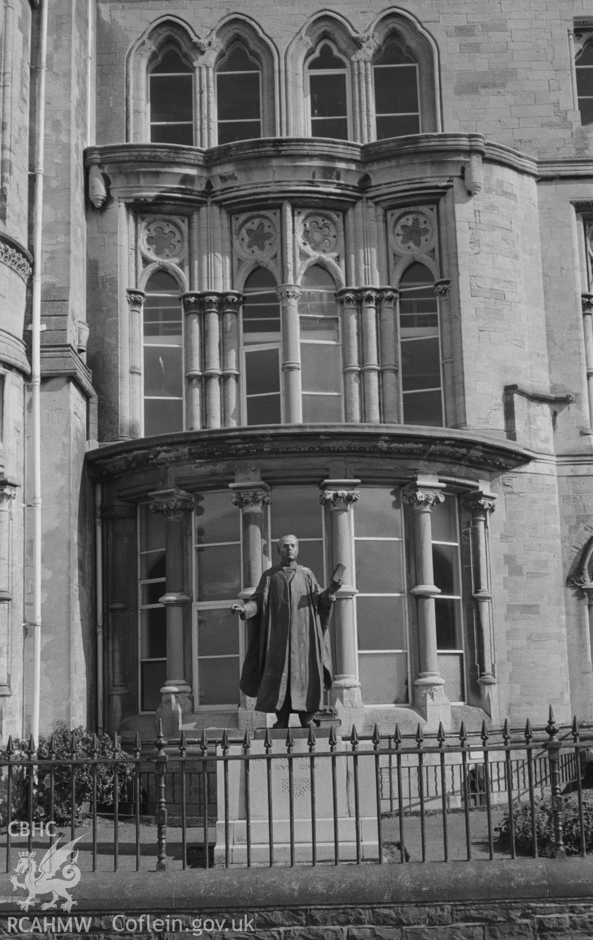 Digital copy of a black and white negative showing the statue of Thomas Charles Edwards on the north west facing side of Old College, Aberystwyth. Photographed by Arthur O. Chater on 15th August 1967 from Grid Reference SN 581 817.