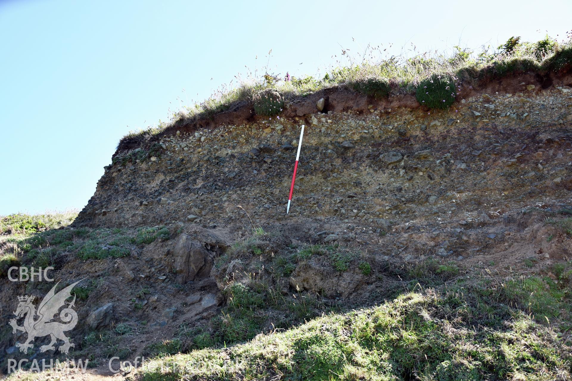 Penmaenmelyn copper mine. View of eastern cliff above mine, in section, with 1m scale.  Investigator?s photographic survey for the CHERISH Project. ? Crown: CHERISH PROJECT 2019. Produced with EU funds through the Ireland Wales Co-operation Programme 2014-2020. All material made freely available through the Open Government Licence.