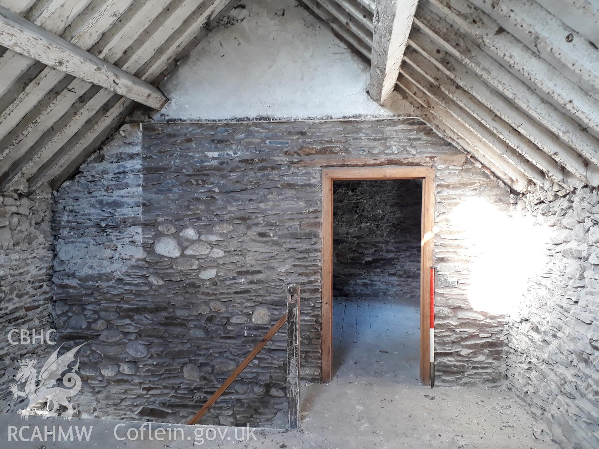 Bedroom 1, doorway to Bedroom 2. View north-west. 1m scale. Photographed as part of archaeological building recording conducted at Bryn Ysguboriau, Llanelidan, Denbighshire, carried out by Archaeology Wales, 2018. Project no. P2587.