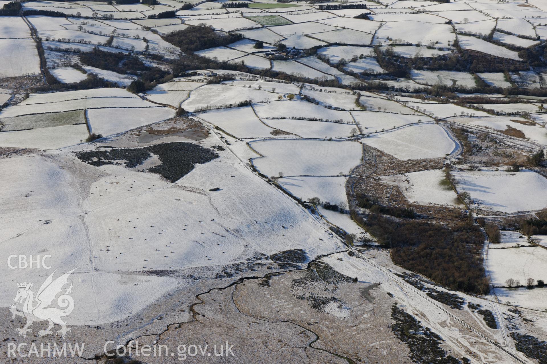 The south western section of the Roman road on Mynydd Illtyd, south west of Brecon. Oblique aerial photograph taken during the Royal Commission?s programme of archaeological aerial reconnaissance by Toby Driver on 15th January 2013.