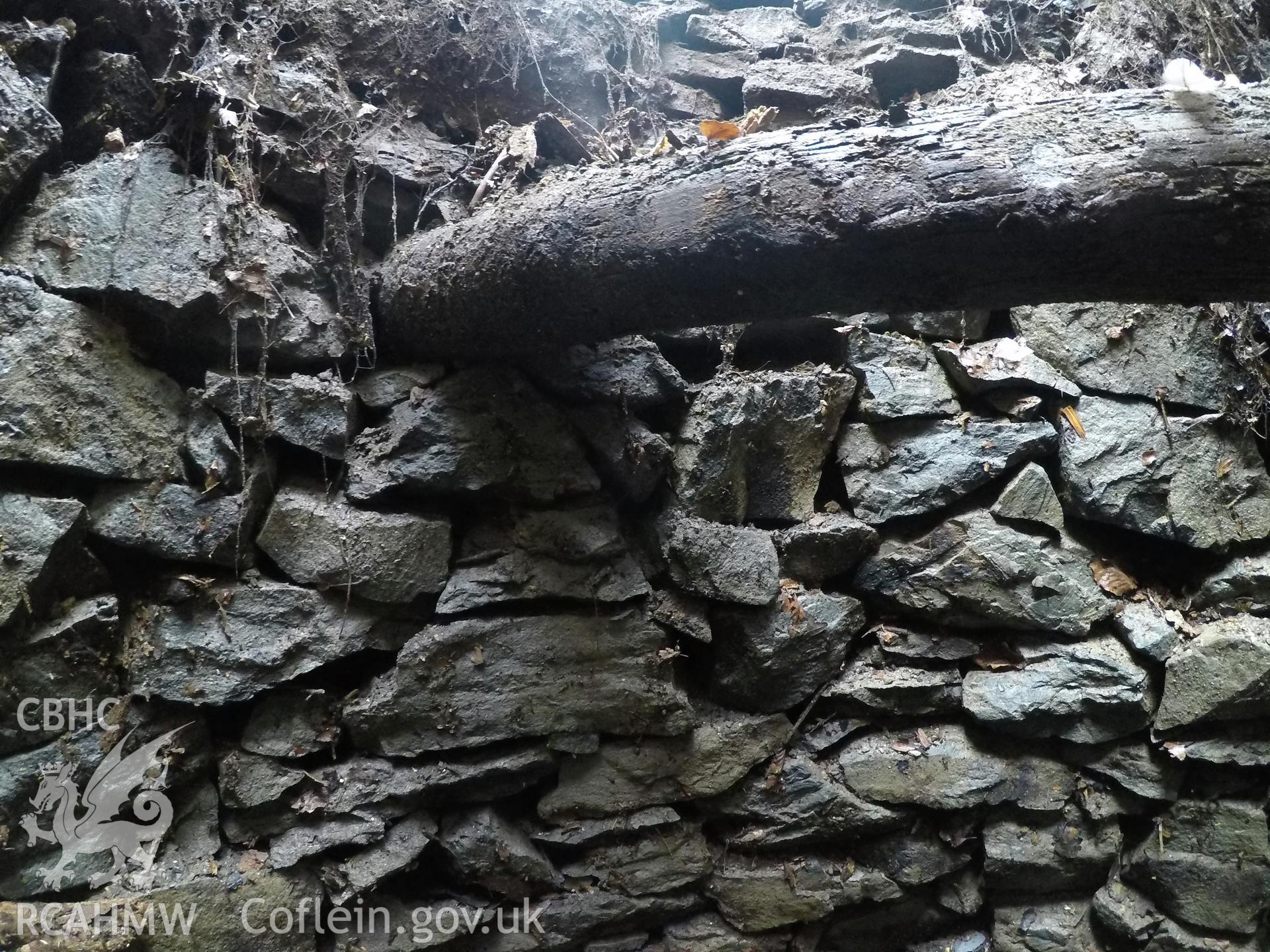 View from the east of well interior at 2.0m depth. Photographed by Gwynedd Archaeological Trust as part of archaeological mitigation report for well at Plas Celynin, Henryd, Conwy, on 1st August 2018. Project no. G2568.