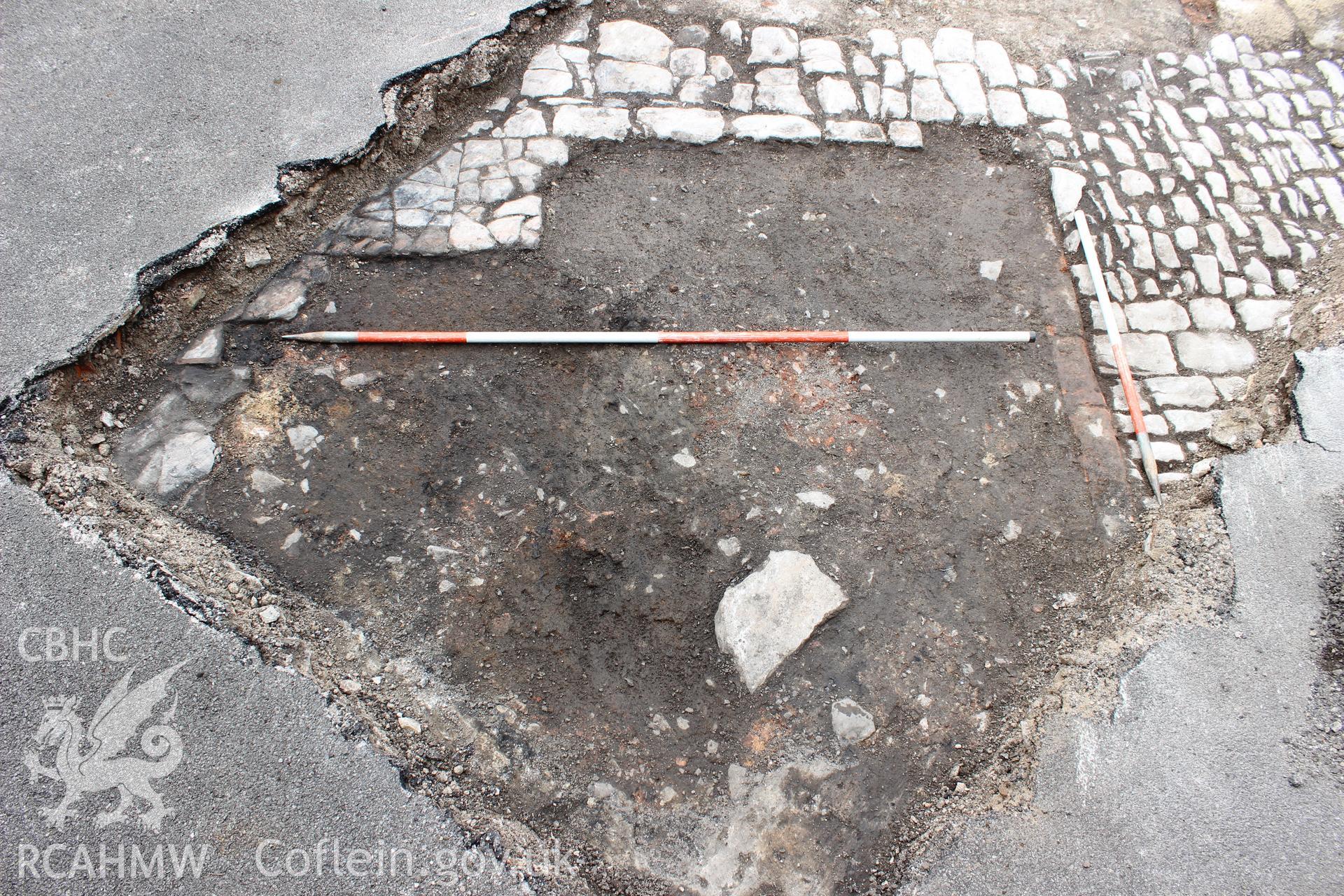 Detail shot of cobbled surfaces and structure. Photographed as part of an Archaeological Evaluation of The Bridge Inn, Chepstow, carried out by Archaeology Wales, 2015.