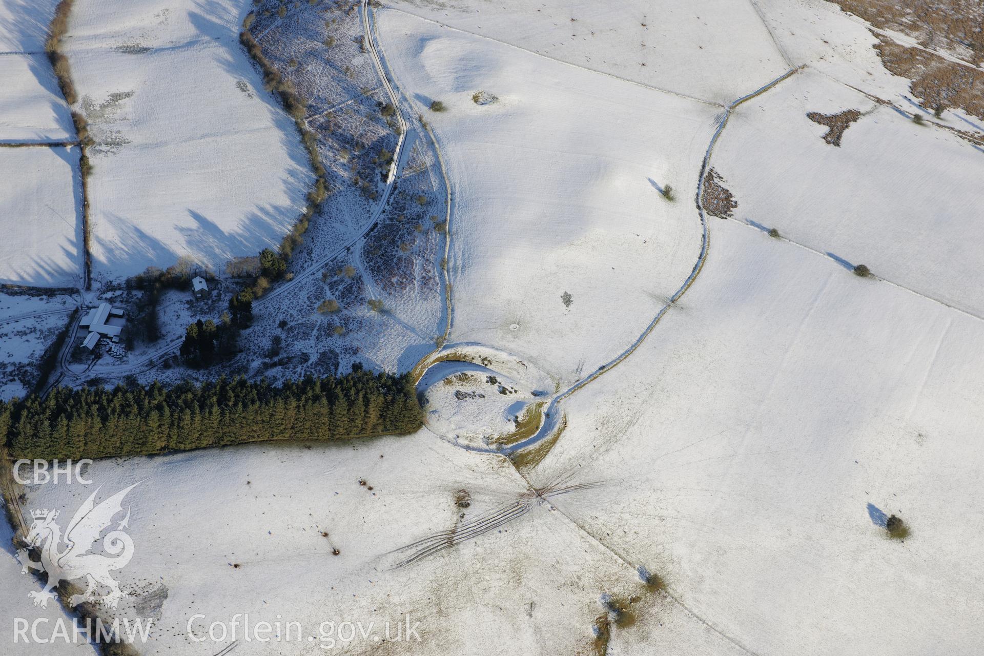 Waun Gynllwch or Coed Caeau defended enclosure, south of Builth Wells. Oblique aerial photograph taken during the Royal Commission?s programme of archaeological aerial reconnaissance by Toby Driver on 15th January 2013.