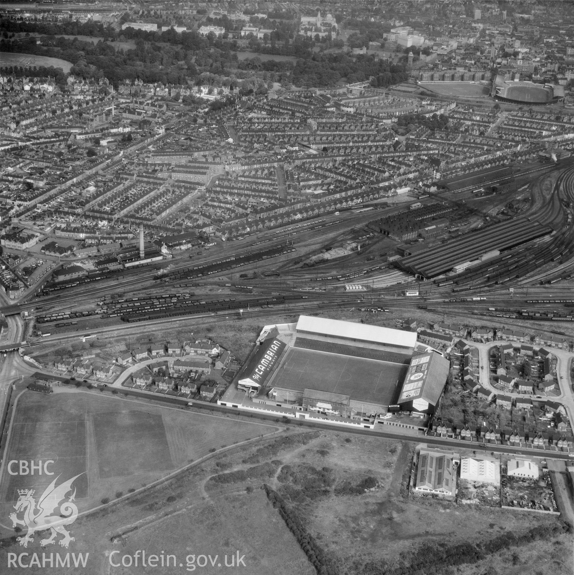 Digital copy of a black and white oblique aerial photograph showing Ninian Park, Cardiff, taken by Aerofilms Ltd, 1959.