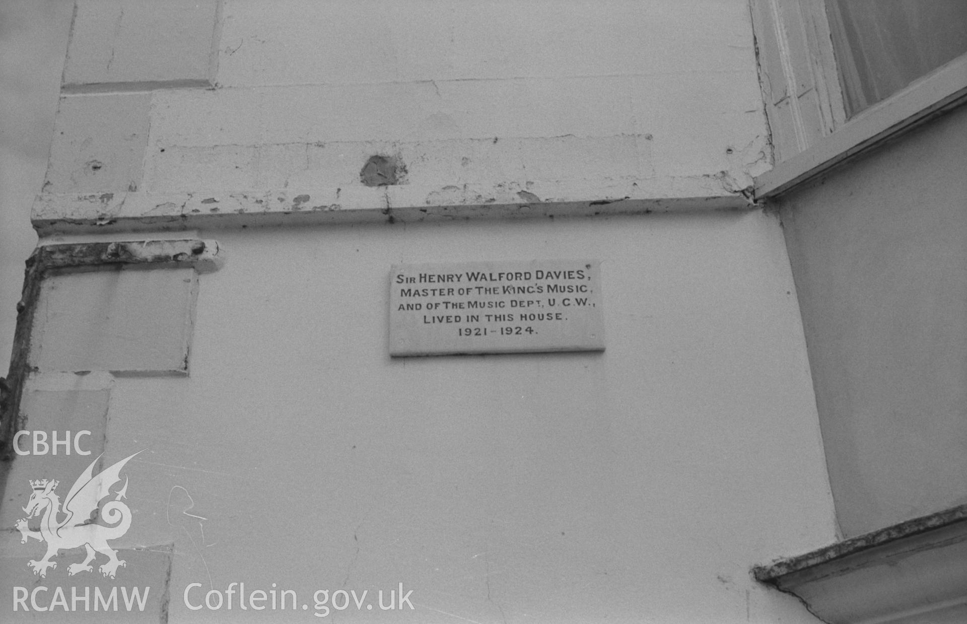 Digital copy of a black and white negative showing marble plaque commemorating Sir Henry Walford Davies, Victoria House, Aberystwyth. Photographed by Arthur O. Chater on 15th August 1967 looking east from Grid Reference SN 584 825.