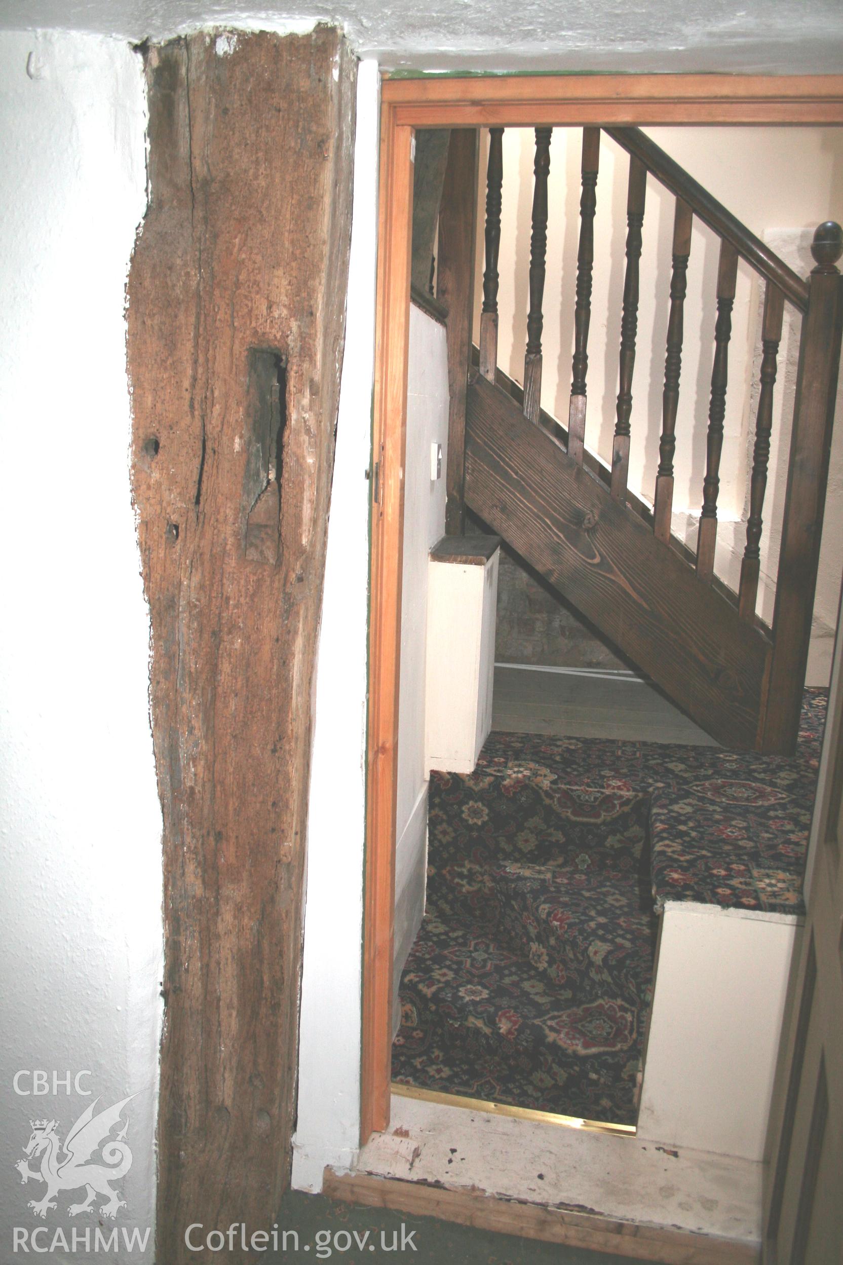 Colour photograph showing detail of arch-brace post with peg holes for ceiling beam at 27 and 31 Vale Street, Denbigh. Photographed during survey conducted by Geoff Ward on 27th March 2008.