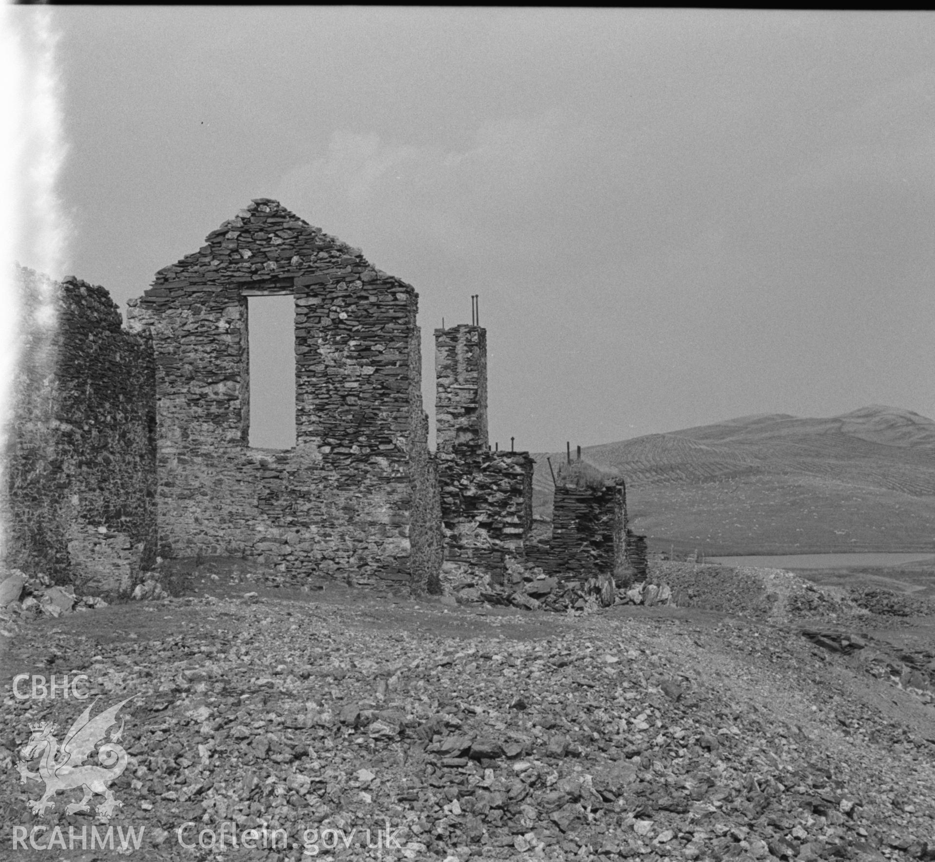Digital copy of a black and white negative showing ruin at the top of Esgair Hir lead mine, Ceulanamaesmawr. Photographed by Arthur O. Chater on 22nd August 1967, looking north east from Grid Reference SN 734 913.