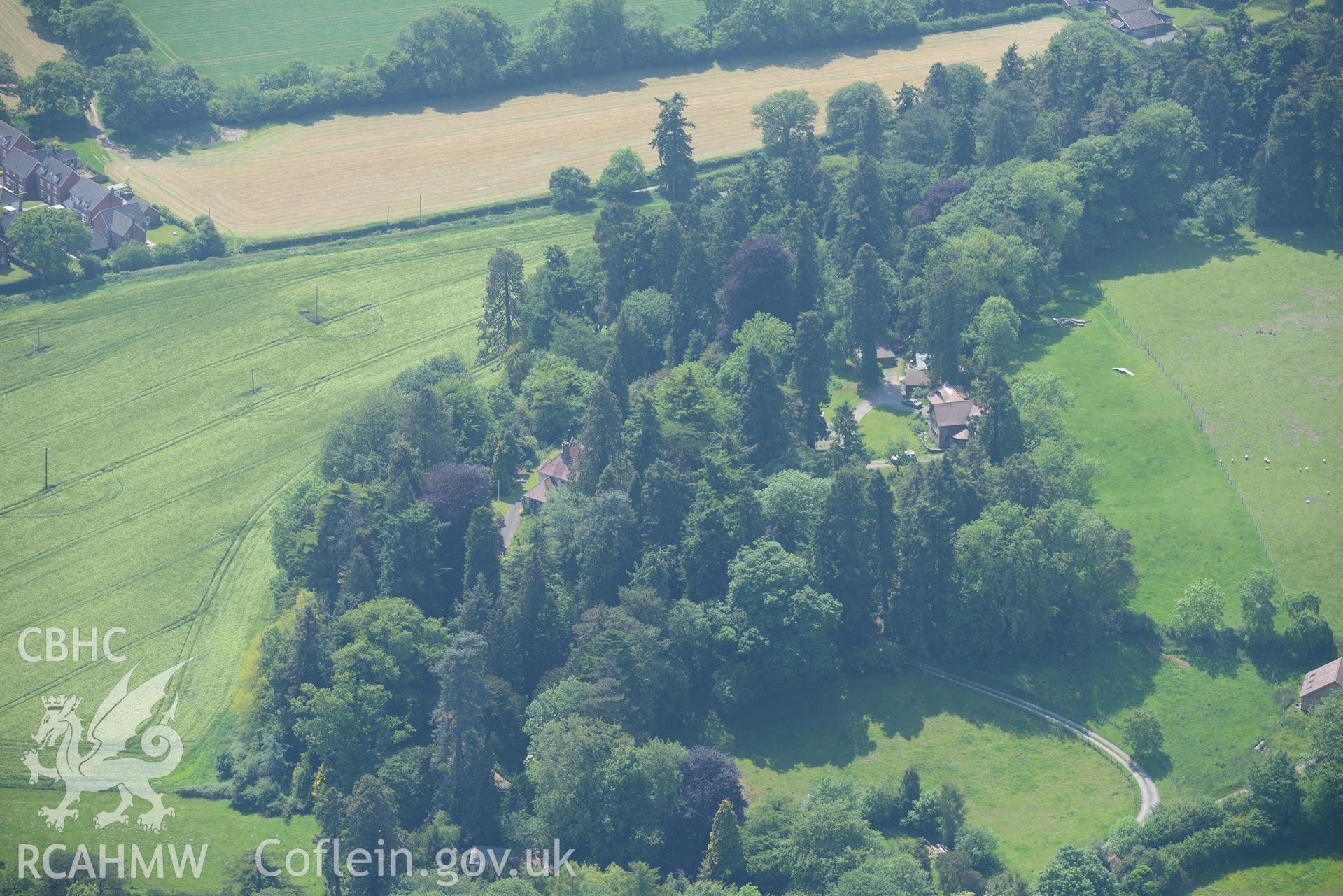Prestigne town and Sila House (in the trees). Oblique aerial photograph taken during the Royal Commission's programme of archaeological aerial reconnaissance by Toby Driver on 11th June 2015.