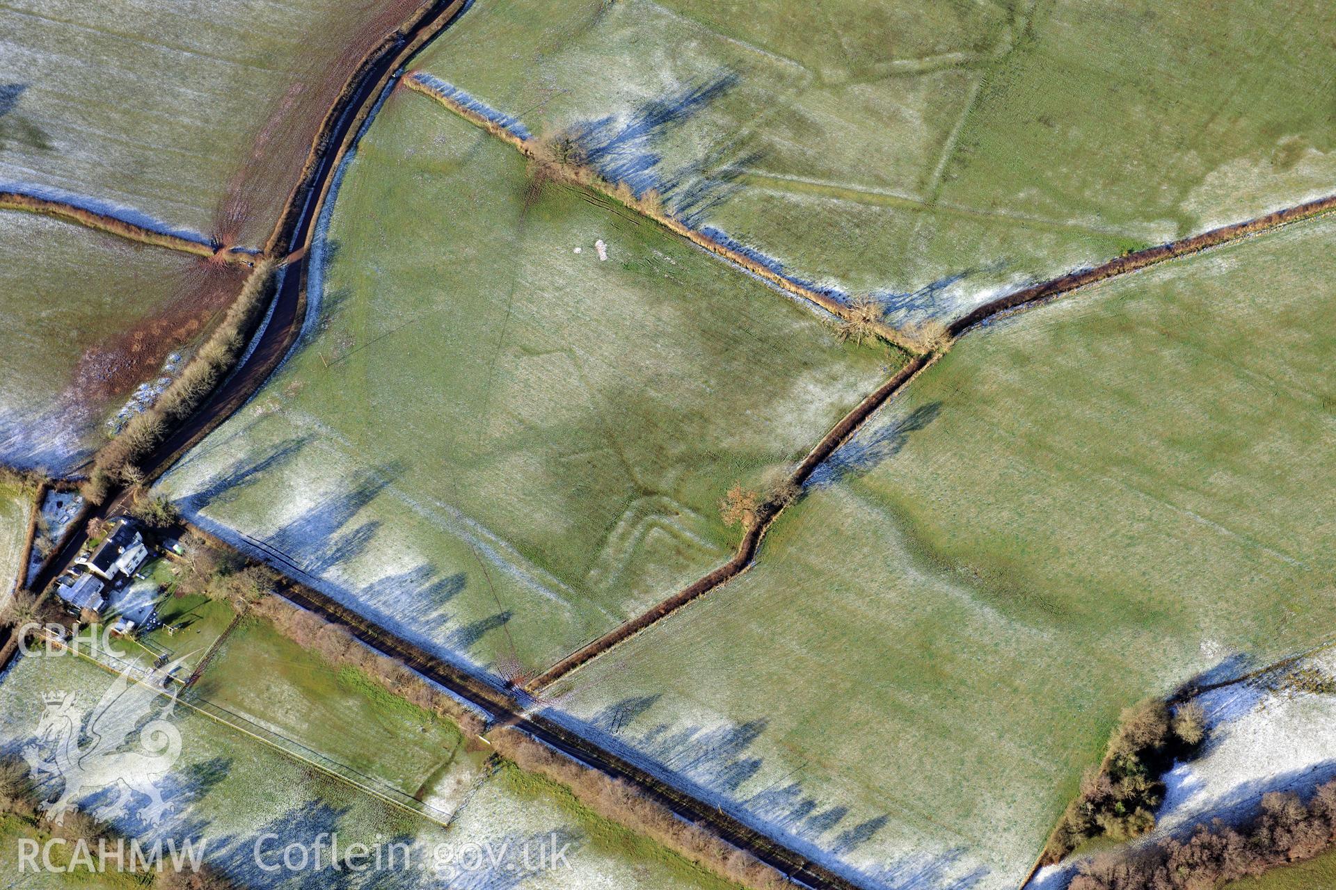 Treberfydd moated site, Llangors, south east of Brecon. Oblique aerial photograph taken during the Royal Commission?s programme of archaeological aerial reconnaissance by Toby Driver on 15th January 2013.