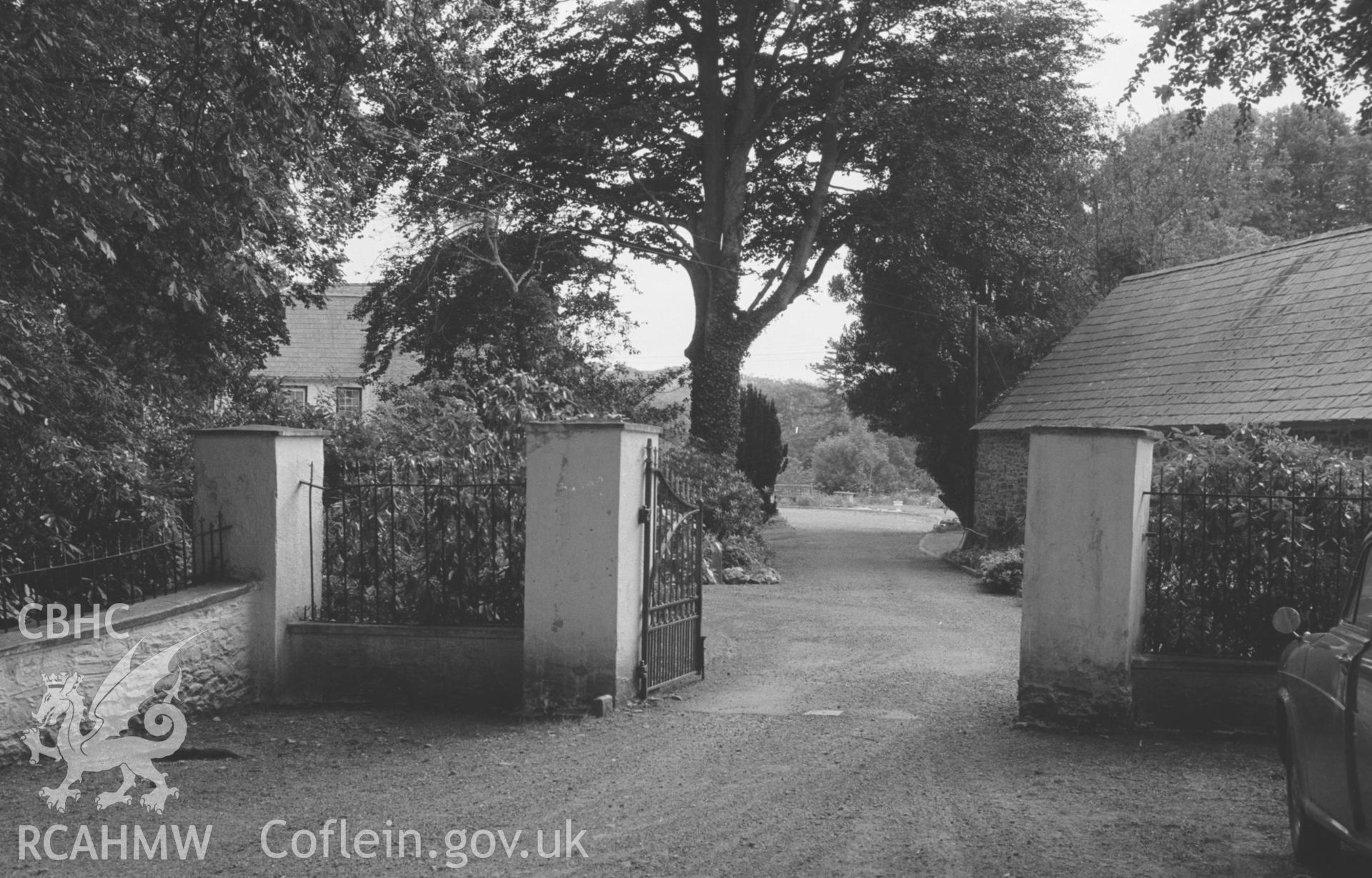 Digital copy of a black and white negative showing entrance gateway to Ty Glyn farm, south east of Aberaeron. Photographed by Arthur O. Chater in August 1965 from Grid Reference SN 4989 5994, looking south south west.